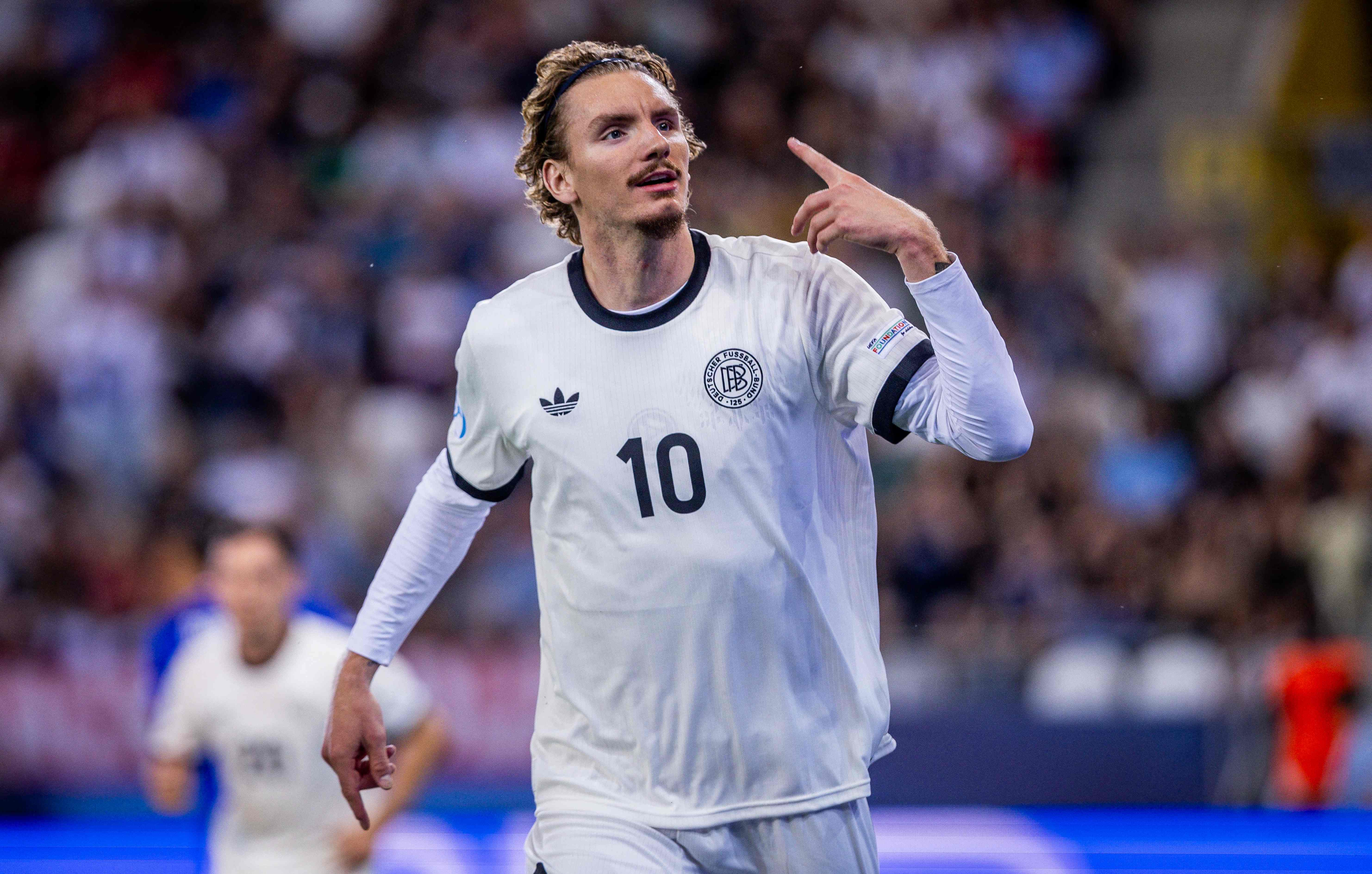 Germany's forward #10 Nick Woltemade celebrates after scoring the 2-0 goal during the UEFA U21 European Championship semi-final football match between Germany and France in Kosice, Slovakia on June 25, 2025. (Photo by Branislav Racko / AFP)