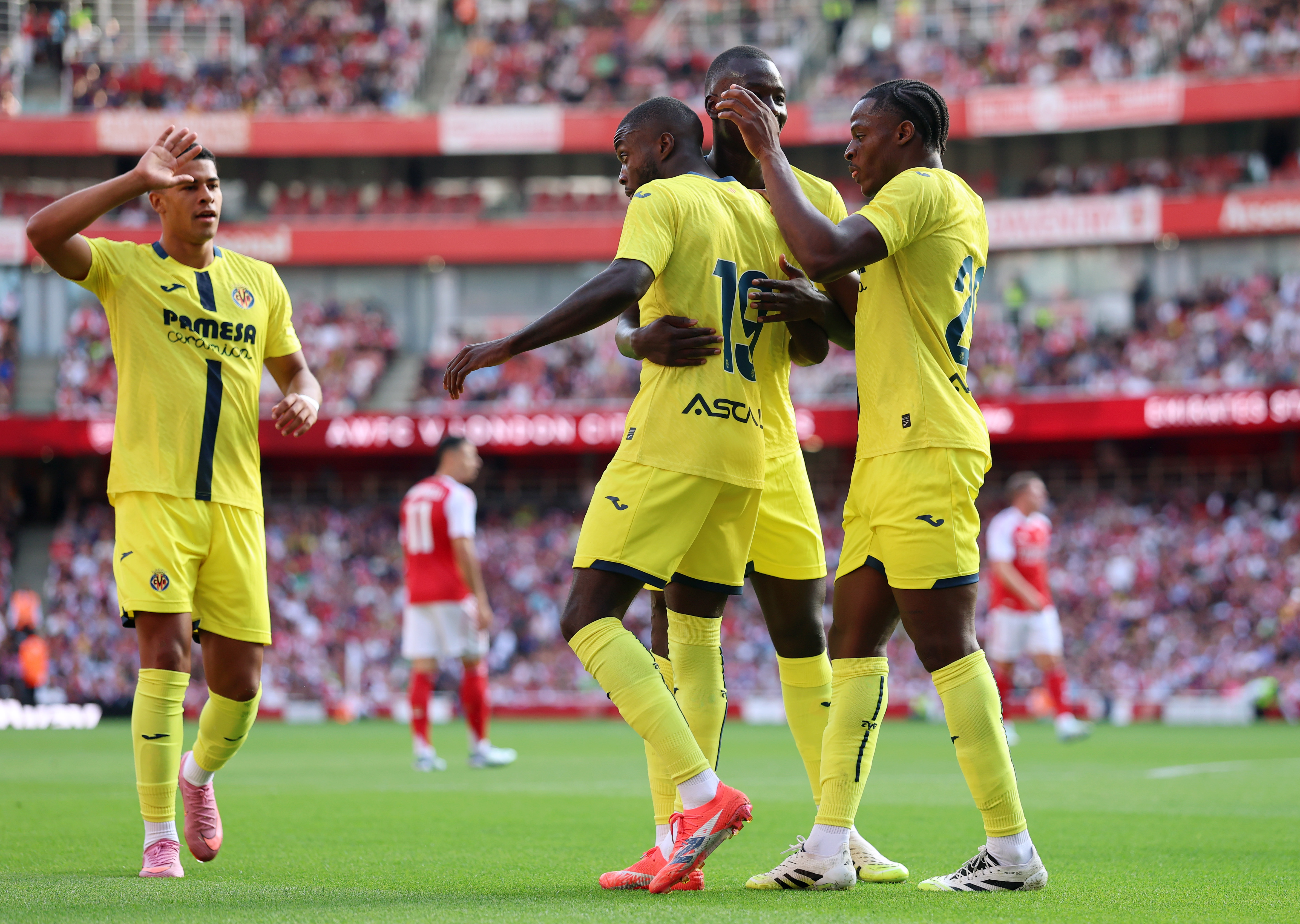 LONDON, ENGLAND - AUGUST 06: Nicolas Pepe of Villarreal CF celebrates scoring his team's first goal with Santiago Mourino, Pape Gueye and Etta Eyong during the pre-season friendly match between Arsenal and Villarreal at Emirates Stadium on August 06, 2025 in London, England. (Photo by Eddie Keogh/Getty Images)