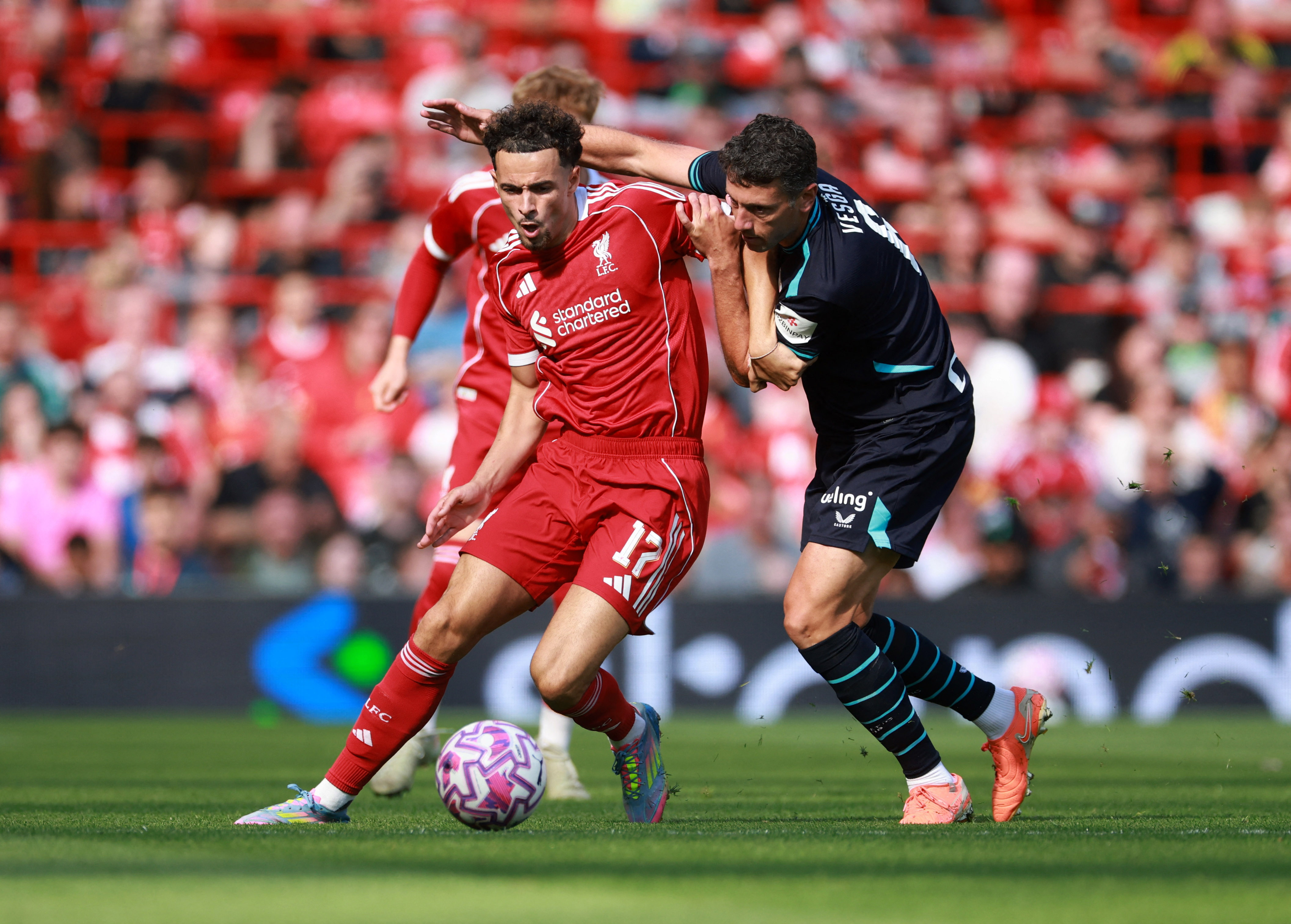 Soccer Football - Friendly - Liverpool v Athletic Bilbao - Anfield, Liverpool, Britain - August 4, 2025 Liverpool's Curtis Jones in action with Athletic Bilbao's Mikel Vesga REUTERS/Phil Noble