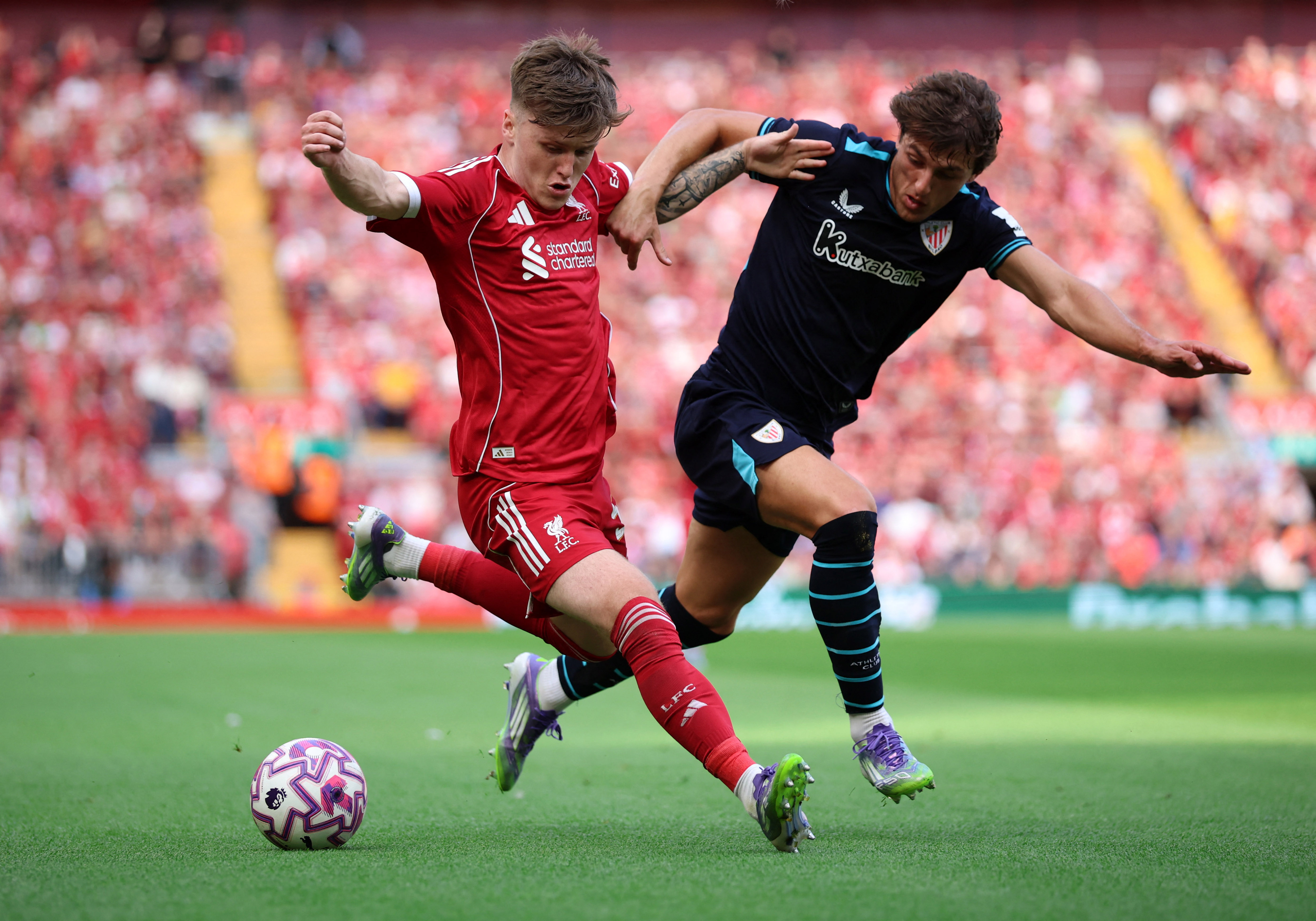 Soccer Football - Friendly - Liverpool v Athletic Bilbao - Anfield, Liverpool, Britain - August 4, 2025 Liverpool's Ben Doak in action with Athletic Bilbao's Unai Gomez REUTERS/Phil Noble