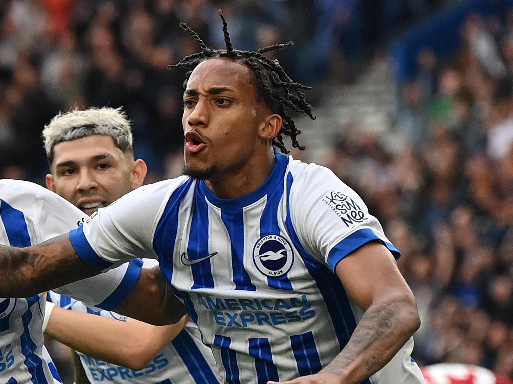 Brighton's Brazilian striker #09 Joao Pedro (R) celebrates scoring the team's second goal with Brighton's French striker #14 Georginio Rutter during the English Premier League football match between Brighton and Hove Albion and Manchester United at the American Express Community Stadium in Brighton, southern England on August 24, 2024. (Photo by Glyn KIRK / AFP) / RESTRICTED TO EDITORIAL USE. No use with unauthorized audio, video, data, fixture lists, club/league logos or 'live' services. Online in-match use limited to 120 images. An additional 40 images may be used in extra time. No video emulation. Social media in-match use limited to 120 images. An additional 40 images may be used in extra time. No use in betting publications, games or single club/league/player publications. /