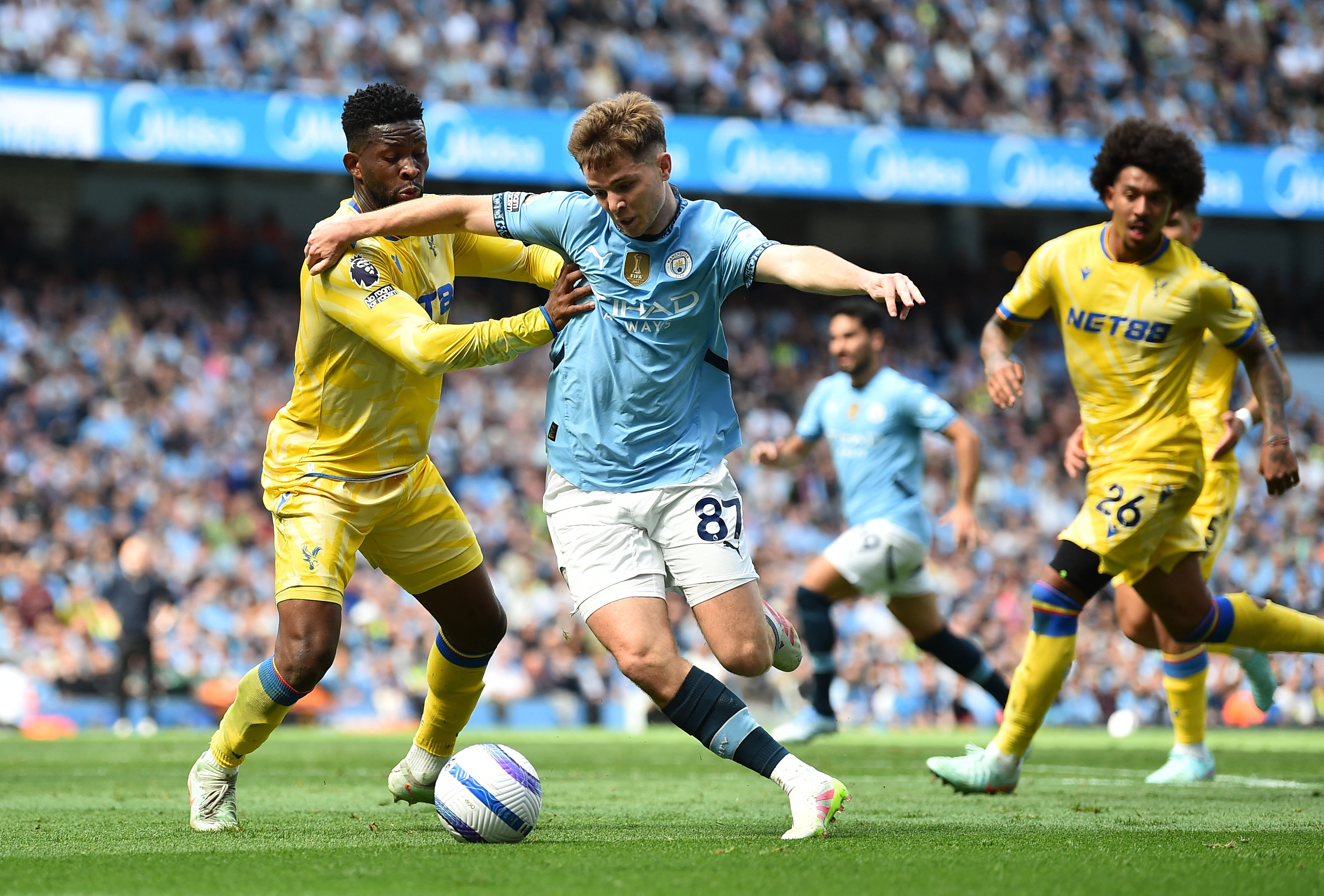 Soccer Football - Premier League - Manchester City v Crystal Palace - Etihad Stadium, Manchester, Britain - April 12, 2025 Manchester City's James McAtee in action with Crystal Palace's Jefferson Lerma REUTERS/Peter Powell EDITORIAL USE ONLY. NO USE WITH UNAUTHORIZED AUDIO, VIDEO, DATA, FIXTURE LISTS, CLUB/LEAGUE LOGOS OR 'LIVE' SERVICES. ONLINE IN-MATCH USE LIMITED TO 120 IMAGES, NO VIDEO EMULATION. NO USE IN BETTING, GAMES OR SINGLE CLUB/LEAGUE/PLAYER PUBLICATIONS. PLEASE CONTACT YOUR ACCOUNT REPRESENTATIVE FOR FURTHER DETAILS..