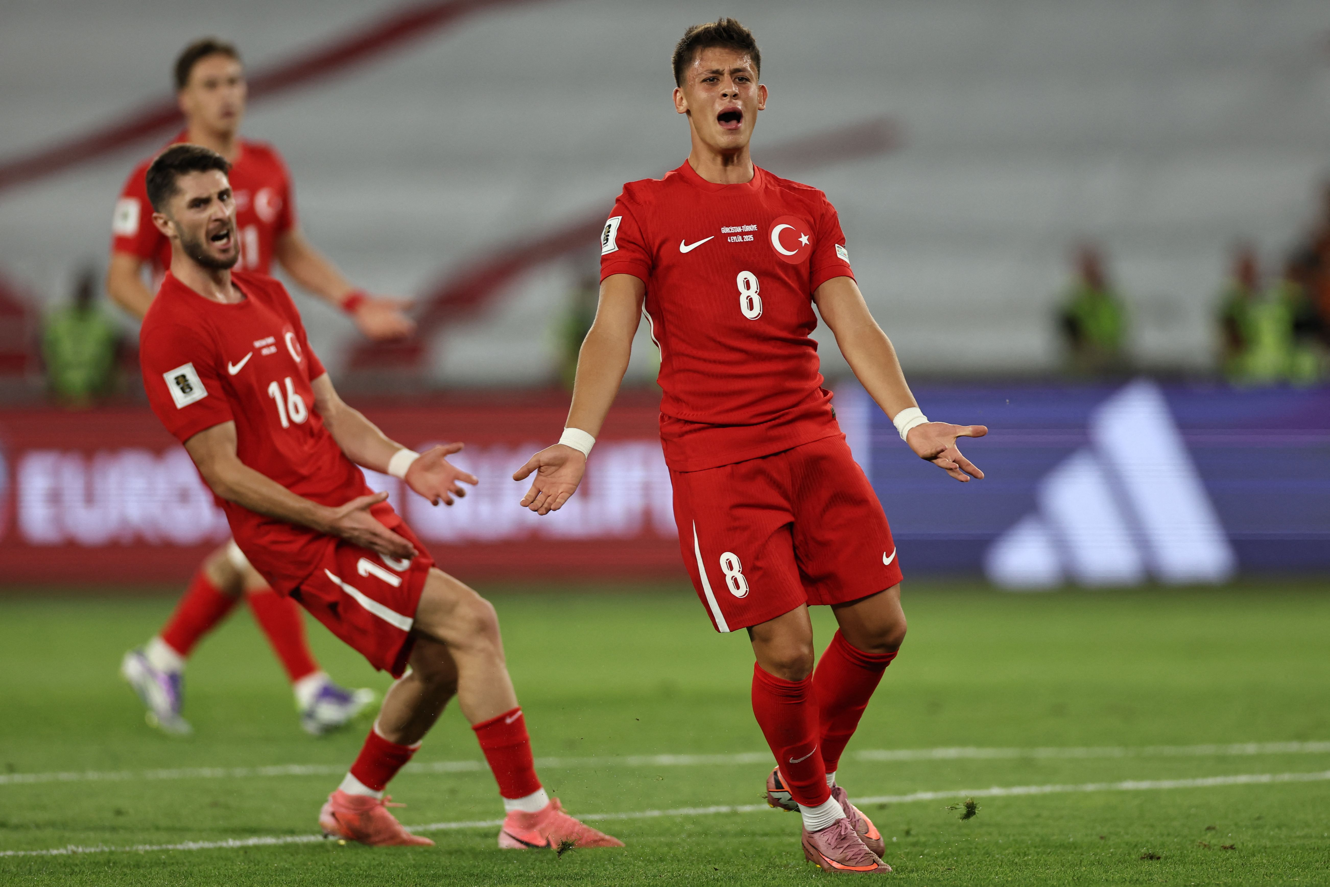 Turkey's midfielder Arda Guler reacts during the 2026 FIFA World Cup qualifying football match between Georgia and Turkey in Tbilisi on September 4, 2025. (Photo by Giorgi ARJEVANIDZE / AFP)