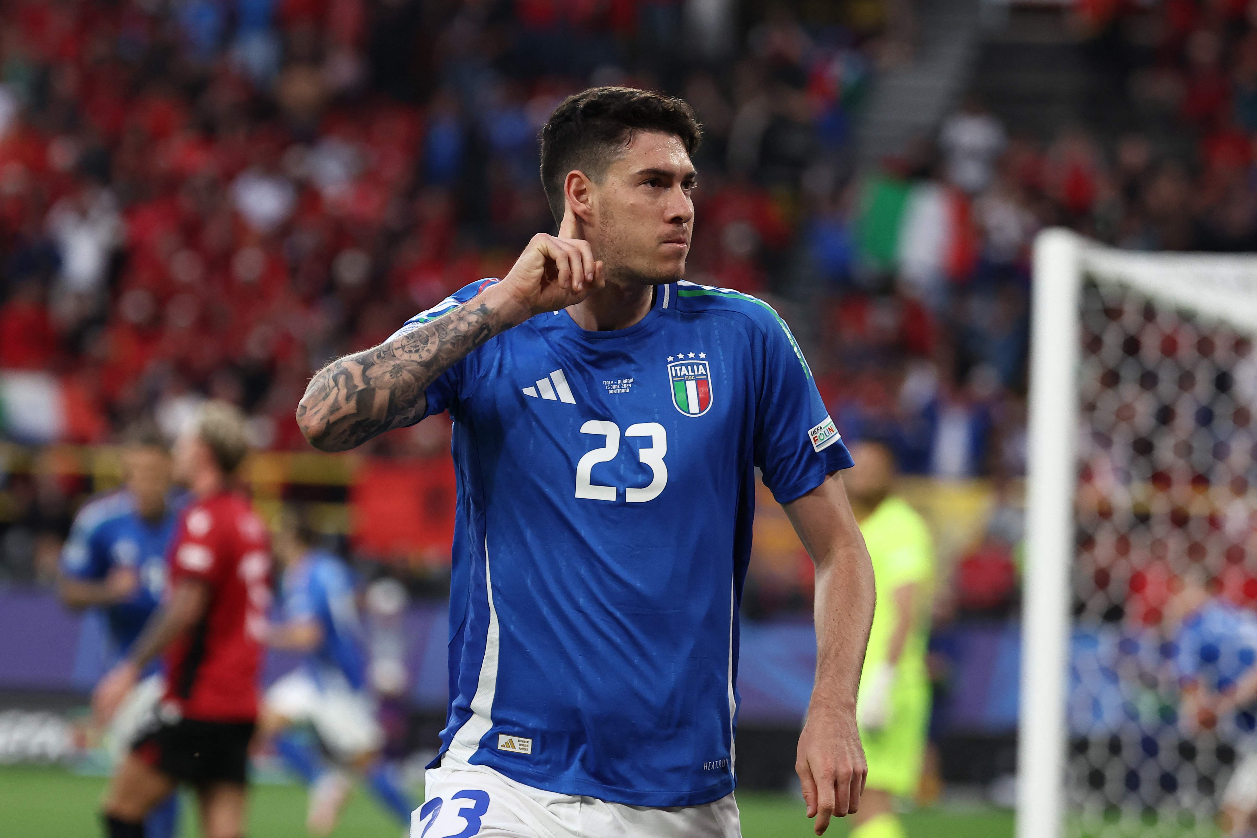 Italy's defender #23 Alessandro Bastoni celebrates scoring his team's first goal during the UEFA Euro 2024 Group B football match between Italy and Albania at the BVB Stadion in Dortmund on June 15, 2024. (Photo by FRANCK FIFE / AFP)
