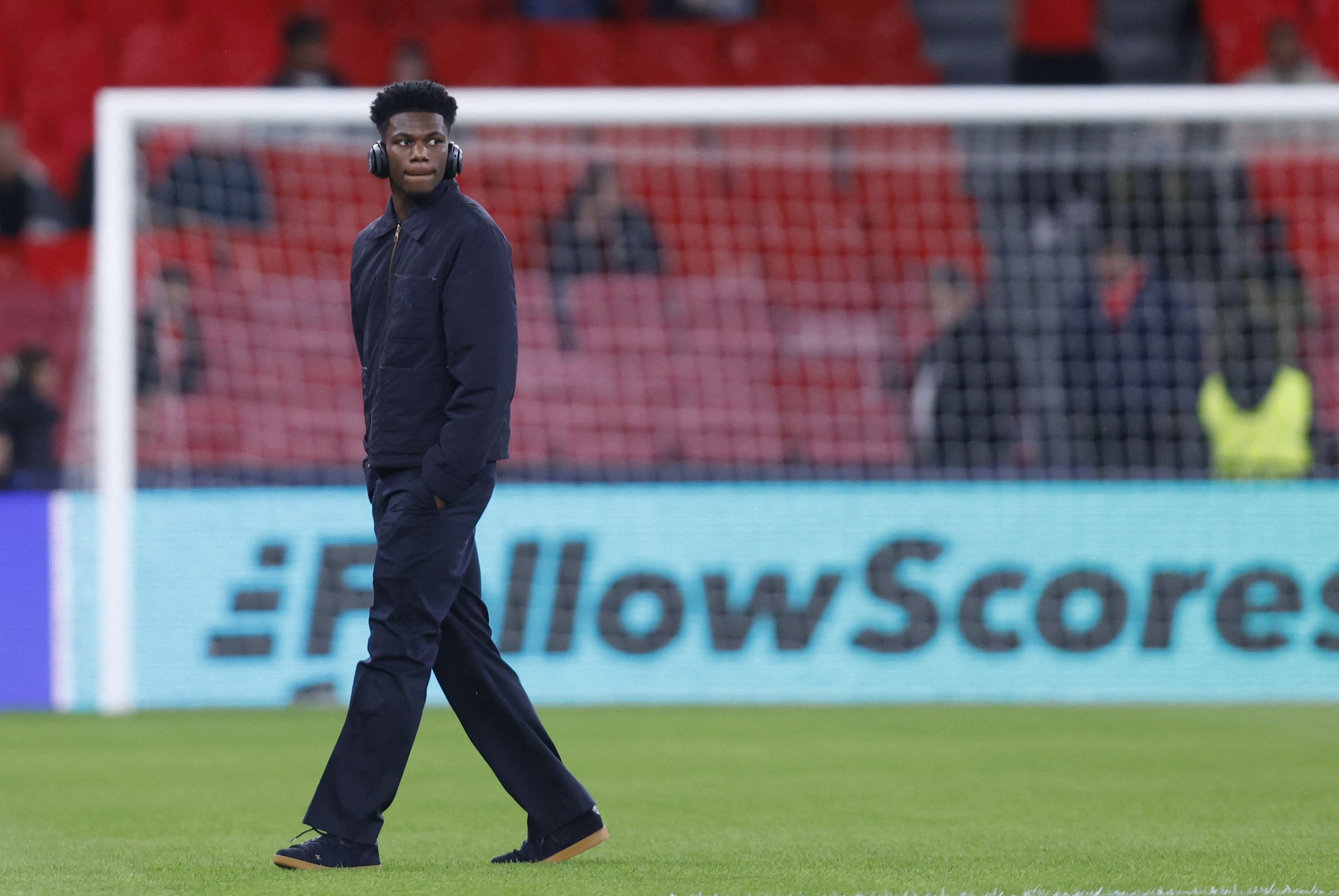 Real Madrid's French midfielder #14 Aurelien Tchouameni walks around the pitch prior the UEFA Champions League knockout round play-off first leg football match between SL Benfica and Real Madrid CF at Estadio da Luz in Lisbon on February 17, 2026. (Photo by FILIPE AMORIM / AFP)