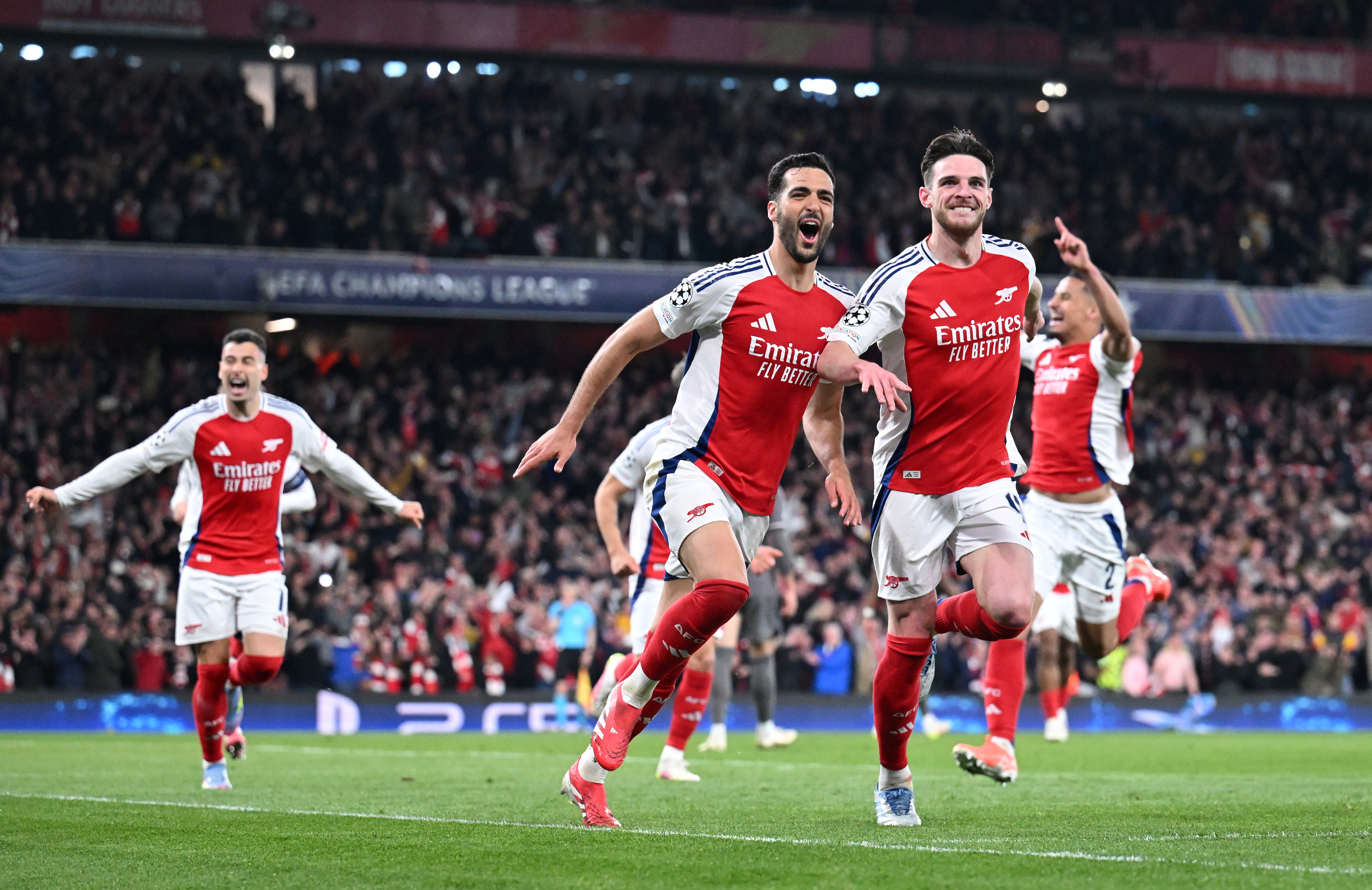 LONDON, ENGLAND - APRIL 08: Mikel Merino of Arsenal celebrates scoring his team's third goal with teammate Declan Rice during the UEFA Champions League 2024/25 Quarter Final First Leg match between Arsenal FC and Real Madrid C.F. at Emirates Stadium on April 08, 2025 in London, England. (Photo by Stuart MacFarlane/Arsenal FC via Getty Images)