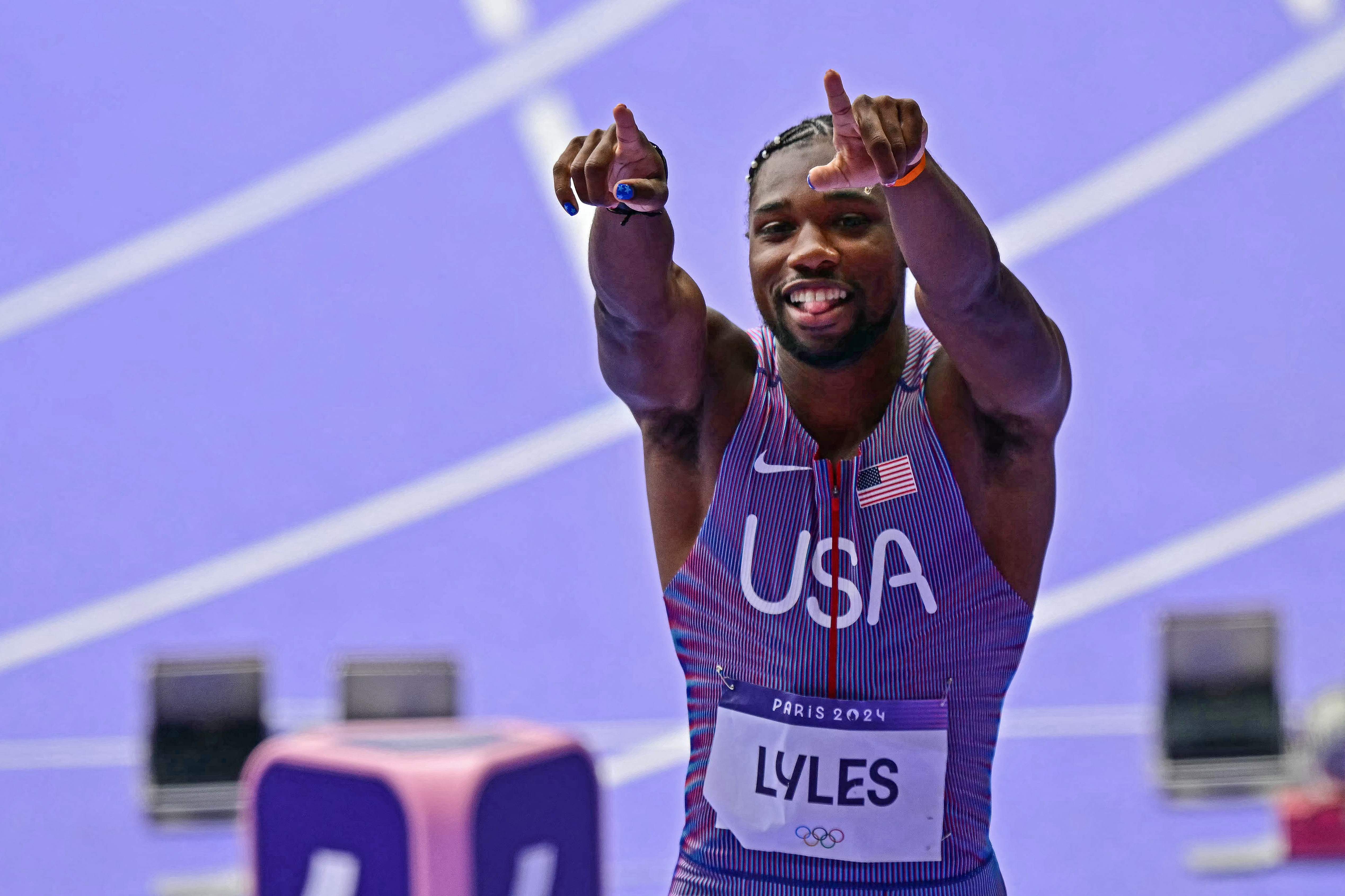 US' Noah Lyles reacts after competing in the men's 100m heat of the athletics event at the Paris 2024 Olympic Games at Stade de France in Saint-Denis, north of Paris, on August 3, 2024. (Photo by Martin  BERNETTI / AFP)
