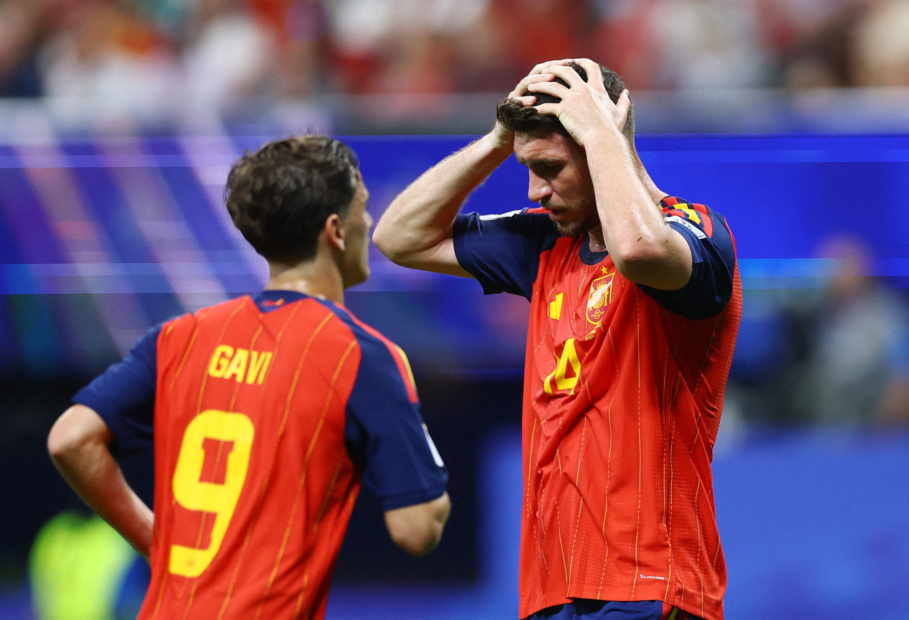 Soccer Football - FIFA World Cup 2026 - Group H - Spain v Cape Verde - Atlanta Stadium, Atlanta, Georgia, U.S. - June 15, 2026 Spain's Aymeric Laporte and Gavi react REUTERS/Claudia Greco