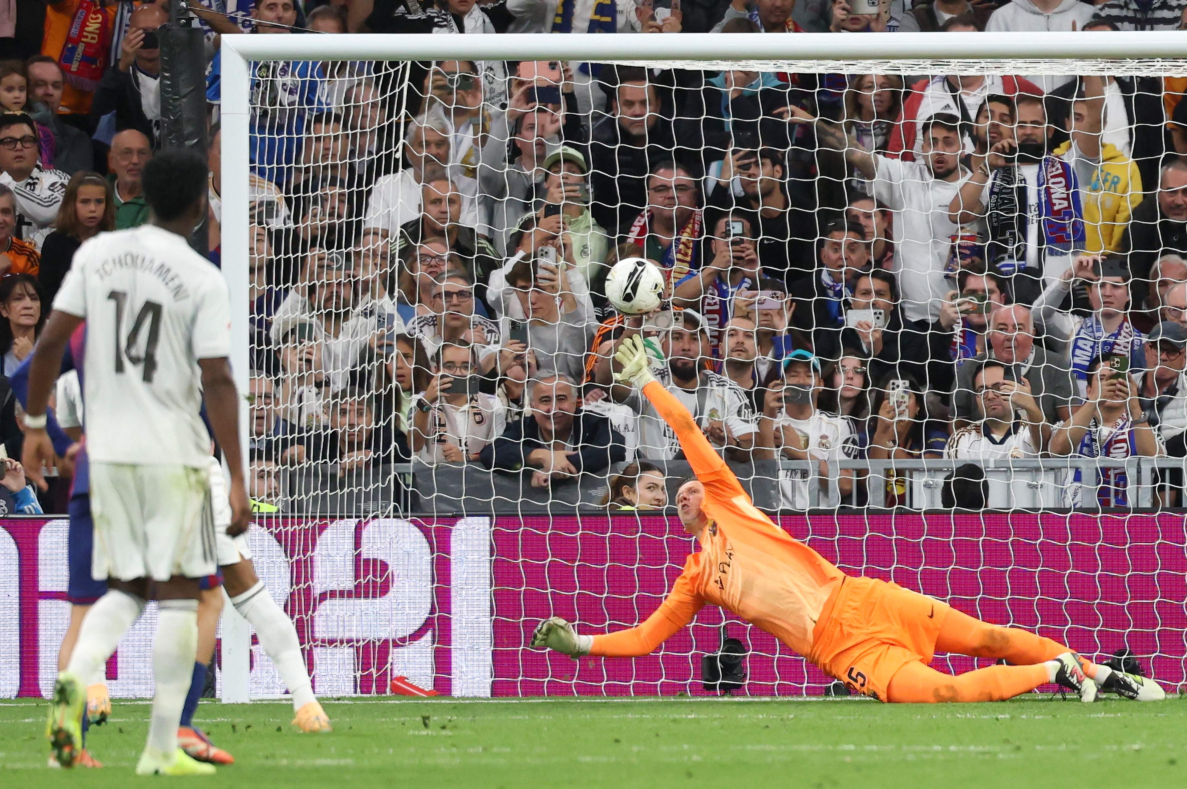 Kylian Mbappe sees spot kick saved.
