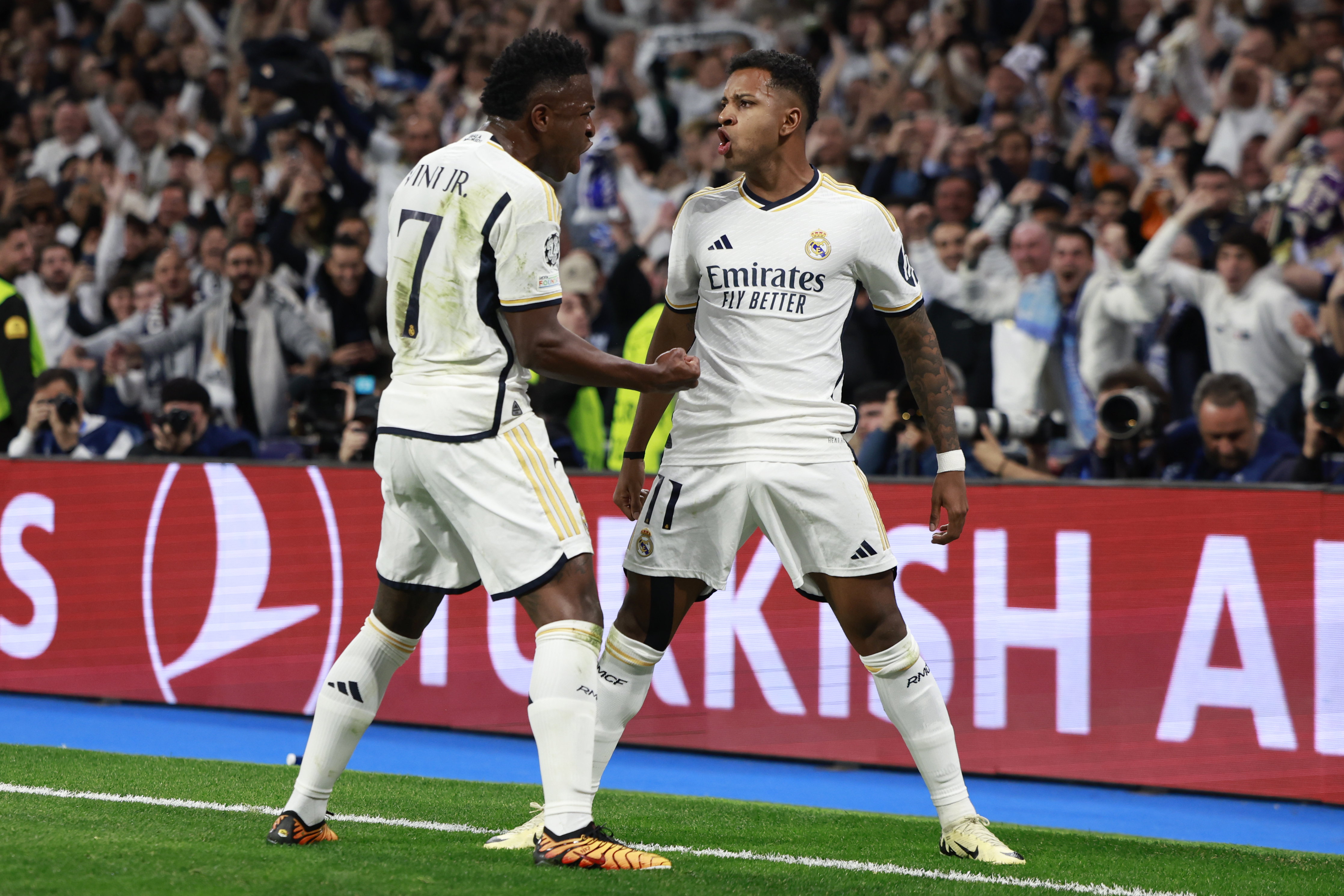 MADRID, SPAIN - APRIL 09: Rodrygo Goes of Real Madrid celebrates with his teammate Vinicius Junior after scoring his team's second goal during the UEFA Champions League quarter-final first leg match between Real Madrid CF and Manchester City at Estadio Santiago Bernabeu on April 09, 2024 in Madrid, Spain. (Photo by Antonio Villalba/Real Madrid via Getty Images)