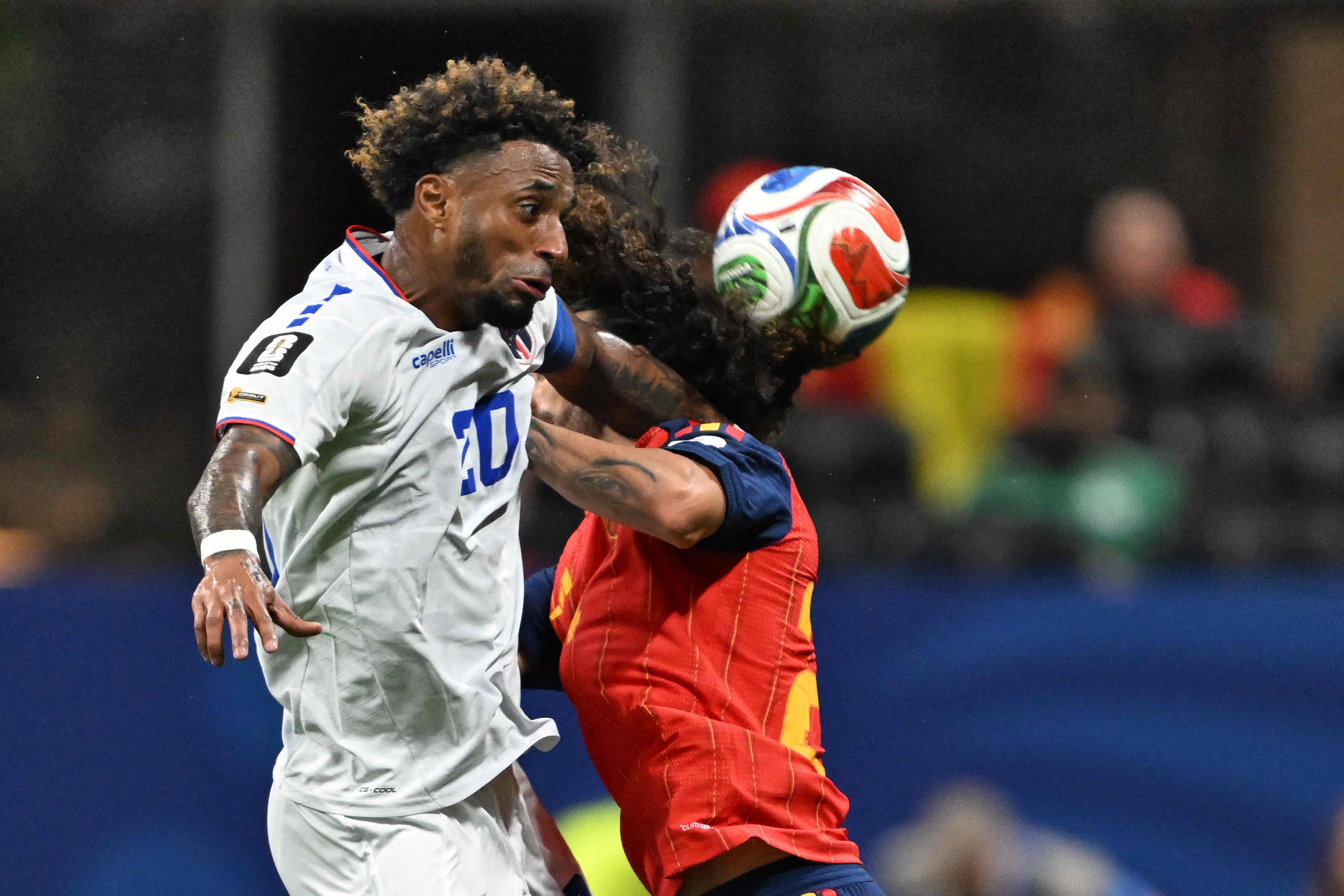 Cape Verde's forward #20 Ryan Mendes (L) fights for the ball with Spain's defender #24 Marc Cucurella during the 2026 World Cup Group H football match between Spain and Cape Verde at the Atlanta Stadium in Atlanta on June 15, 2026.  (Photo by Roberto SCHMIDT / AFP)