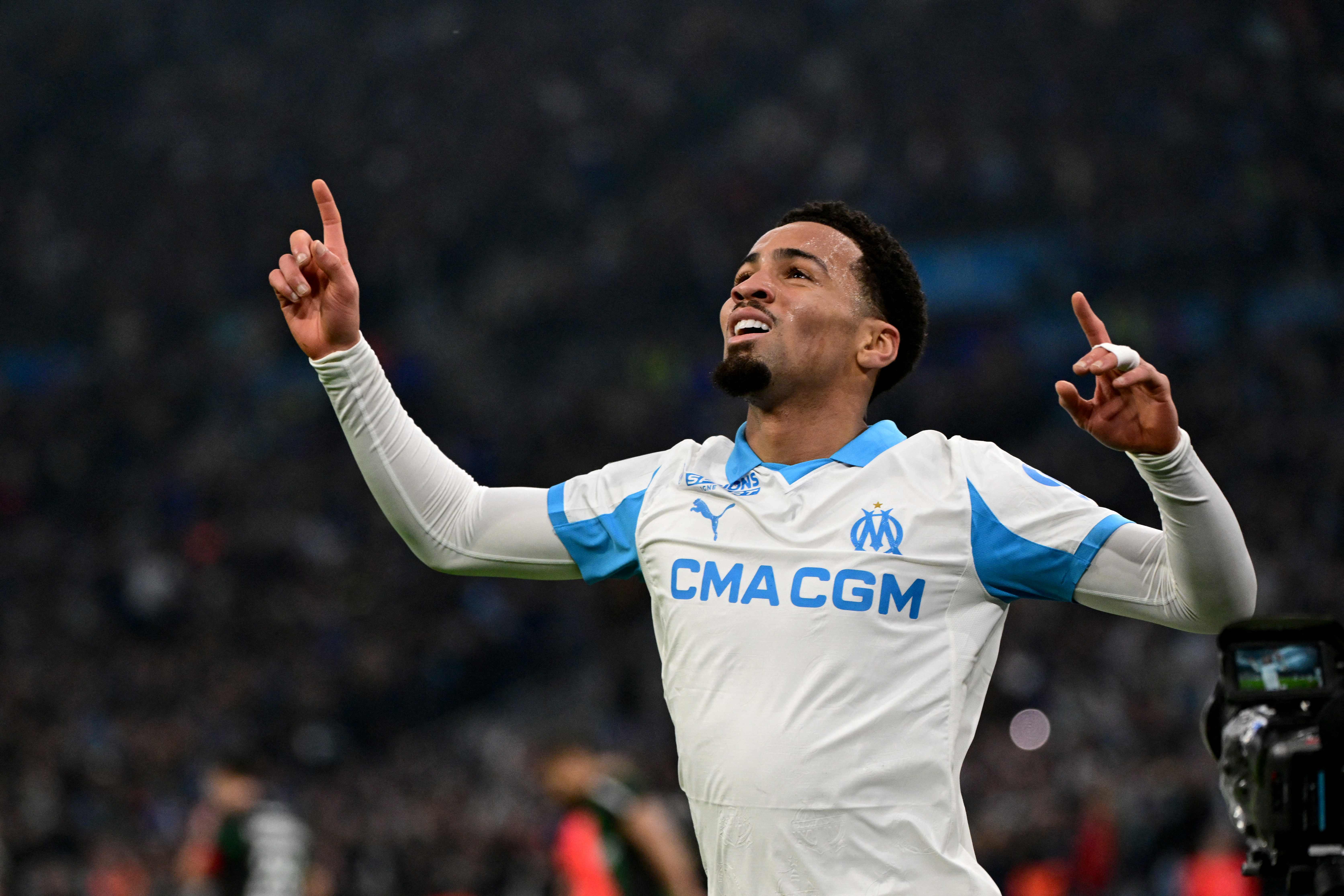Marseille's English midfielder #11 Ethan Nwaneri celebrates after scoring a goal during the French L1 football match between Olympique de Marseille (OM) and RC Lens at the Stade Velodrome in Marseille, southern France, on January 24, 2026. (Photo by Miguel MEDINA / AFP)