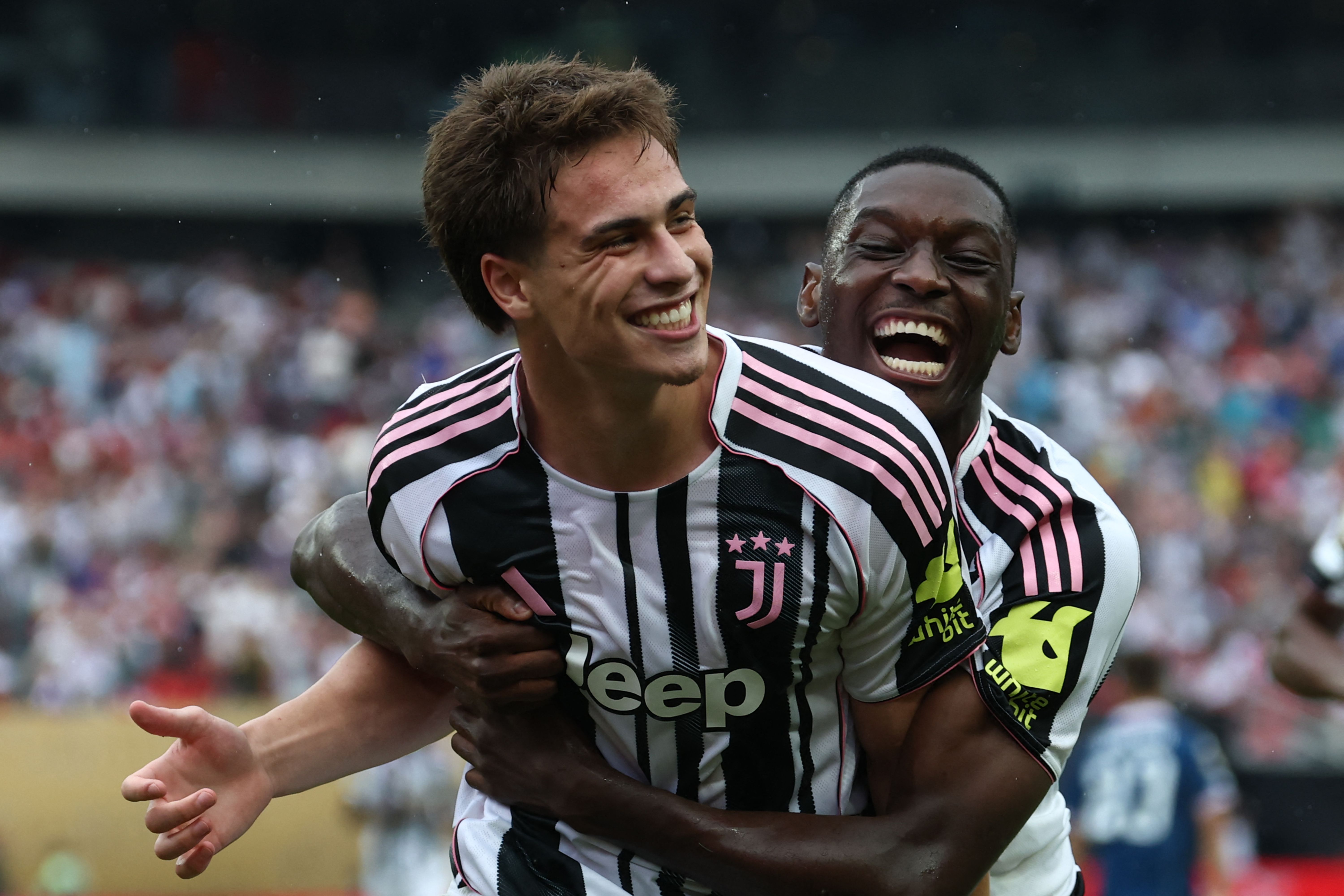 Juventus' Turkish midfielder #10 Kenan Yildiz (L) is congratulated by Juventus' French forward #20 Randal Kolo Muani after scoring his team's third goal during the FIFA Club World Cup 2025 Group G football match between Italy's Juventus and Morocco's Wydad AC at the Lincoln Financial Field stadium in Philadelphia on June 22, 2025. (Photo by FRANCK FIFE / AFP)