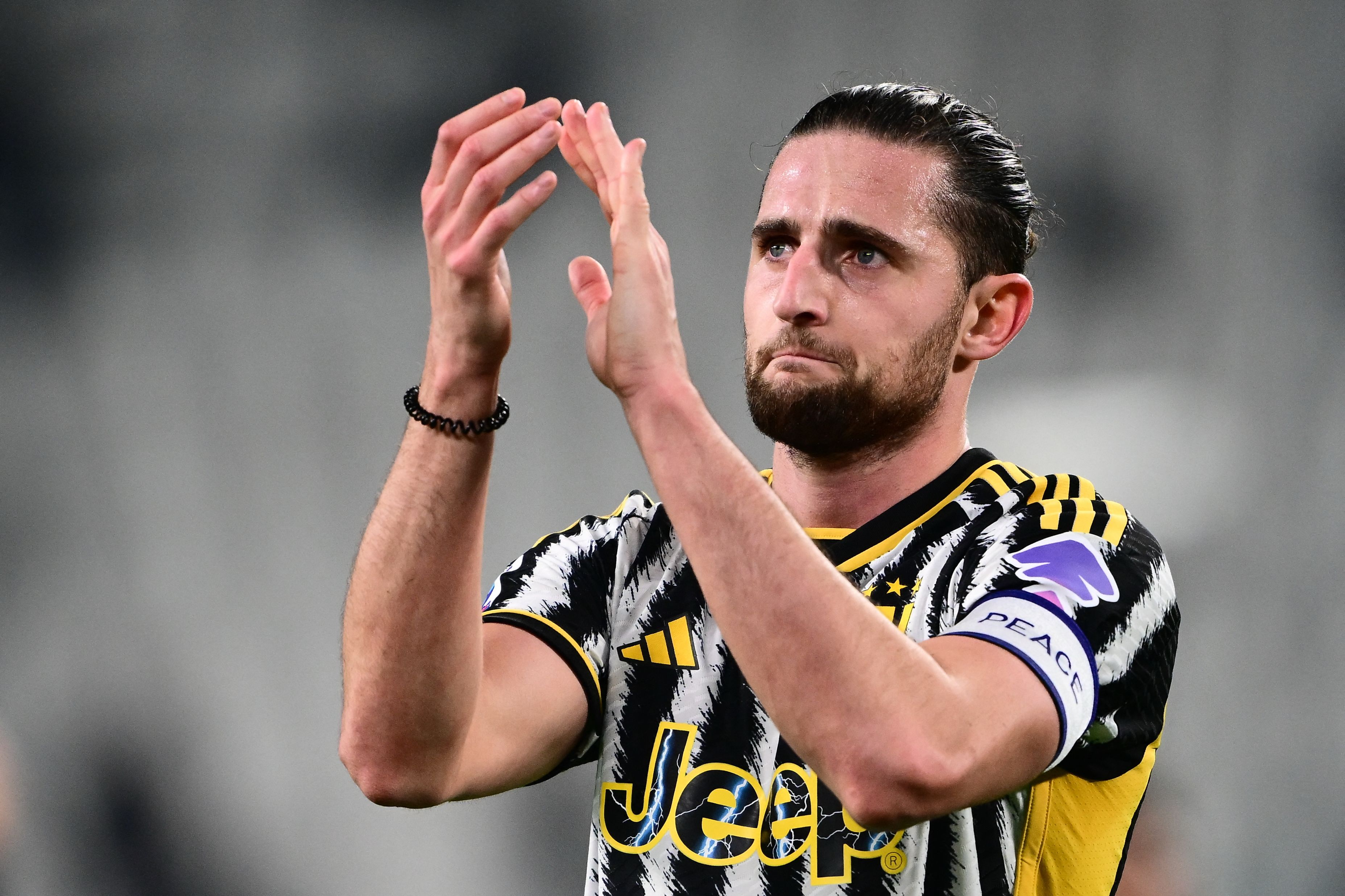 (FILES) Juventus French midfielder Adrien Rabiot greets fans at the end of the Italian Serie A football match between Juventus and Udinese at the �Allianz Stadium� in Turin on February 12, 2024. Adrien Rabiot is no longer a Juventus player after the Serie A club's sporting director Cristiano Giuntoli confirmed on July 18, 2024, that the France midfielder's contract would not be renewed. (Photo by MARCO BERTORELLO / AFP)