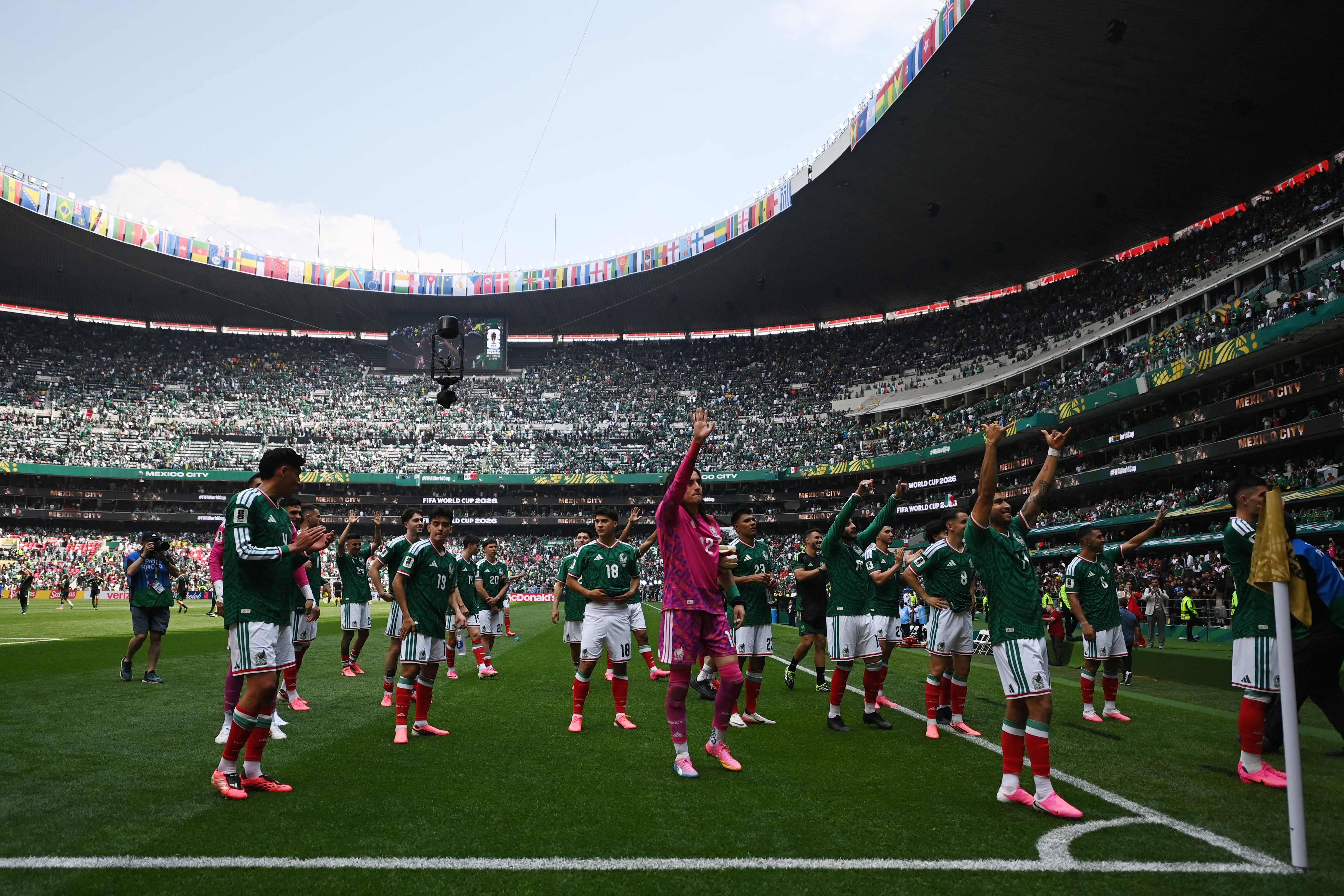 Mexico's players celebrate after winning the 2026 World Cup Group A football match between Mexico and South Africa at the Mexico City Stadium in Mexico City on June 11, 2026. (Photo by CARL DE SOUZA / AFP)