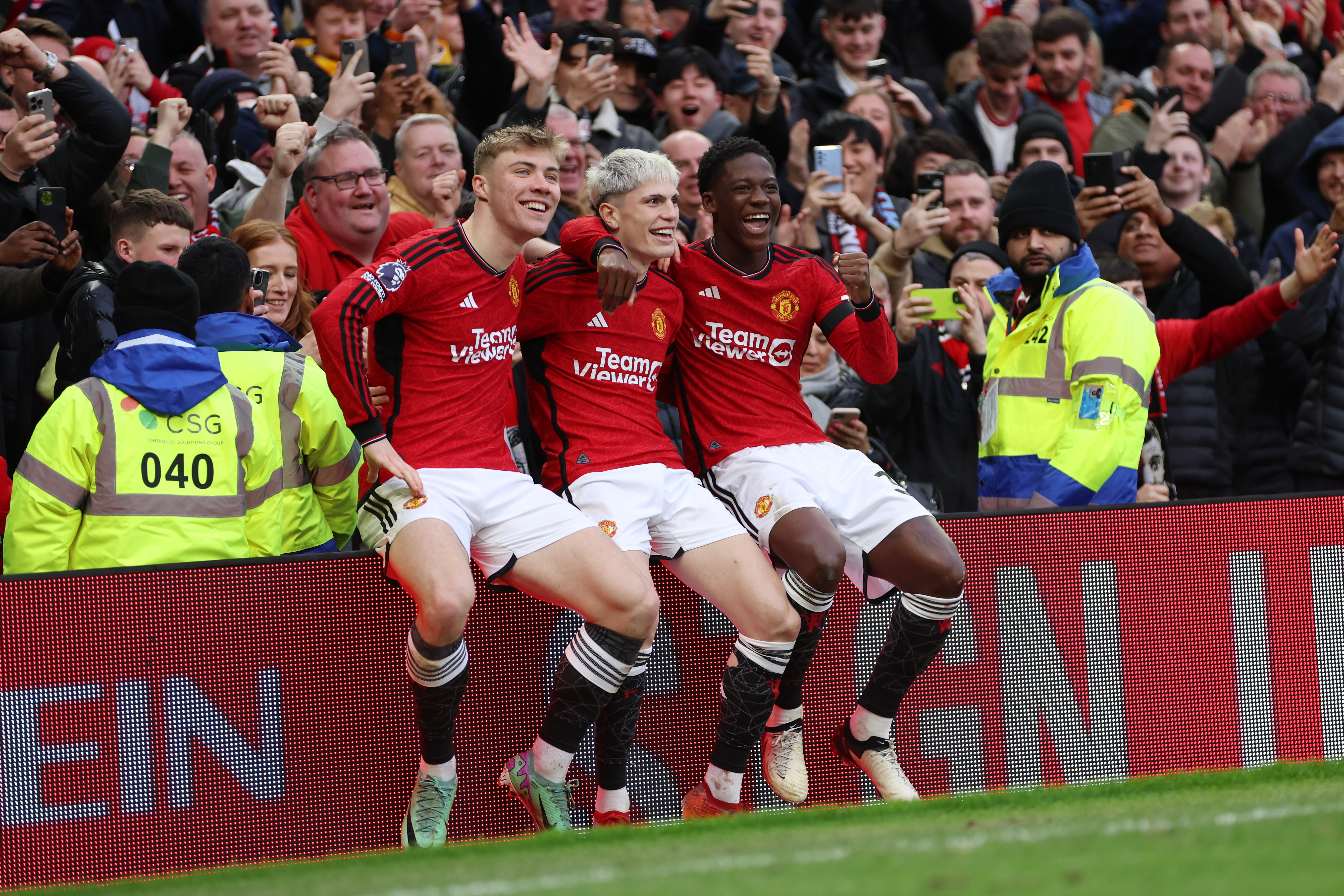 MANCHESTER, ENGLAND - FEBRUARY 04: Alejandro Garnacho of Manchester United celebrates with Rasmus Hojlund and Kobbie Mainoo of Manchester United after scoring his team's second goal during the Premier League match between Manchester United and West Ham United at Old Trafford on February 04, 2024 in Manchester, England. (Photo by Clive Brunskill/Getty Images)