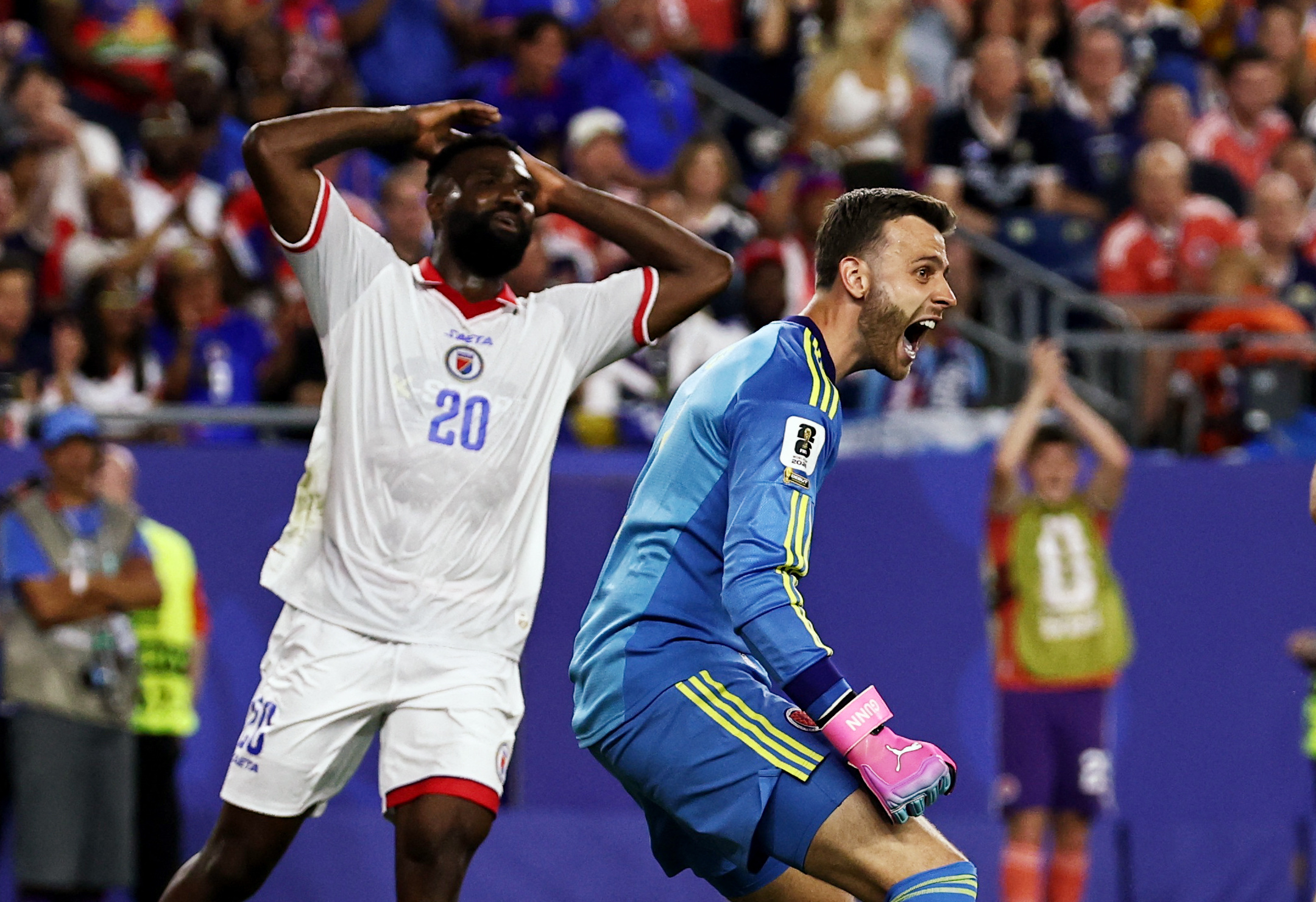 Soccer Football - FIFA World Cup 2026 - Group C - Haiti v Scotland - Boston Stadium, Foxborough, Massachusetts, U.S. - June 13, 2026 Scotland's Angus Gunn reacts as Haiti's Frantzdy Pierrot looks dejected IMAGN IMAGES via Reuters/Winslow Townson