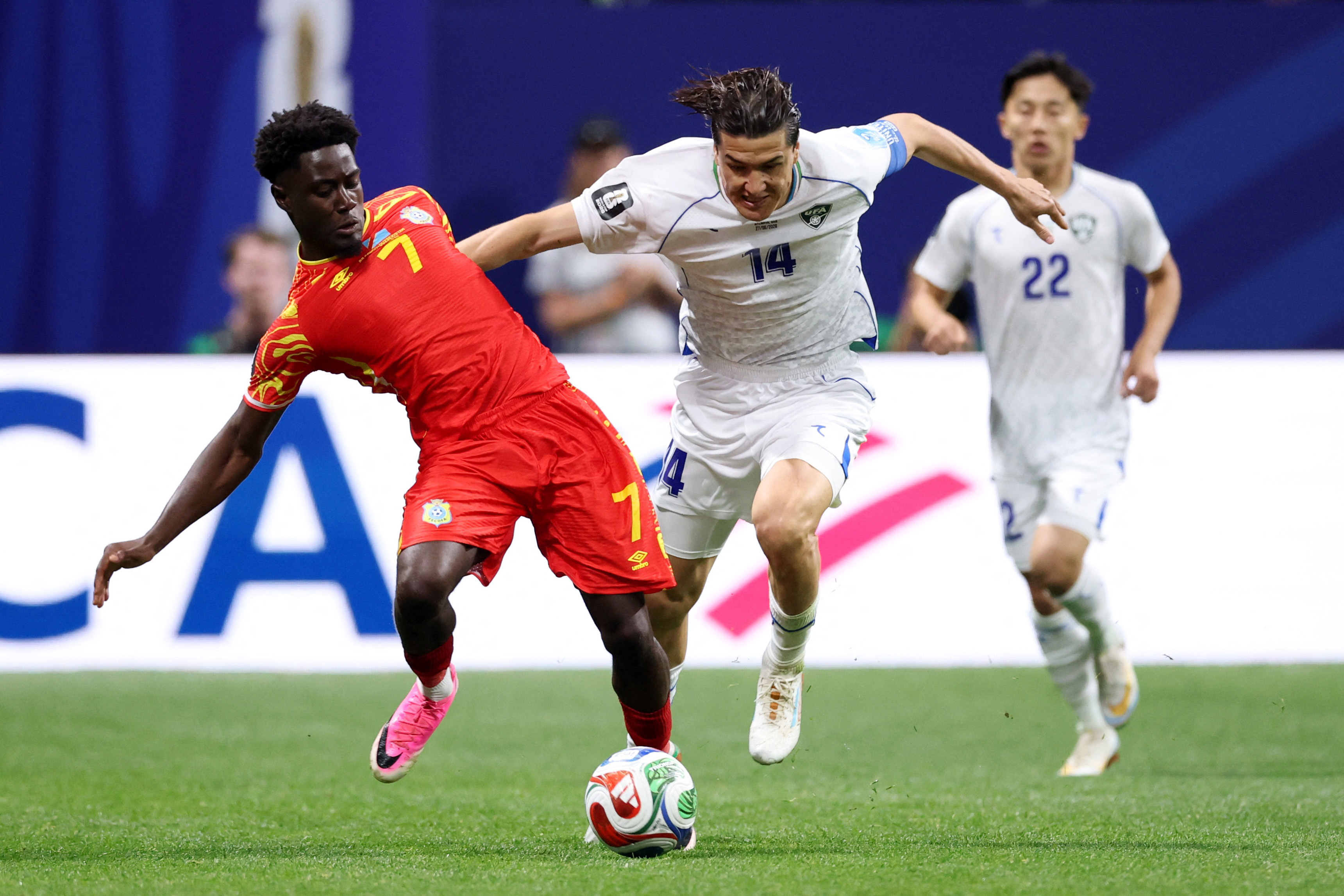 Soccer Football - FIFA World Cup 2026 - Group K - DR Congo v Uzbekistan - Atlanta Stadium, Atlanta, Georgia, U.S. - June 27, 2026 DR Congo's Nathanael Mbuku in action with Uzbekistan's Eldor Shomurodov IMAGN IMAGES via Reuters/Brett Davis