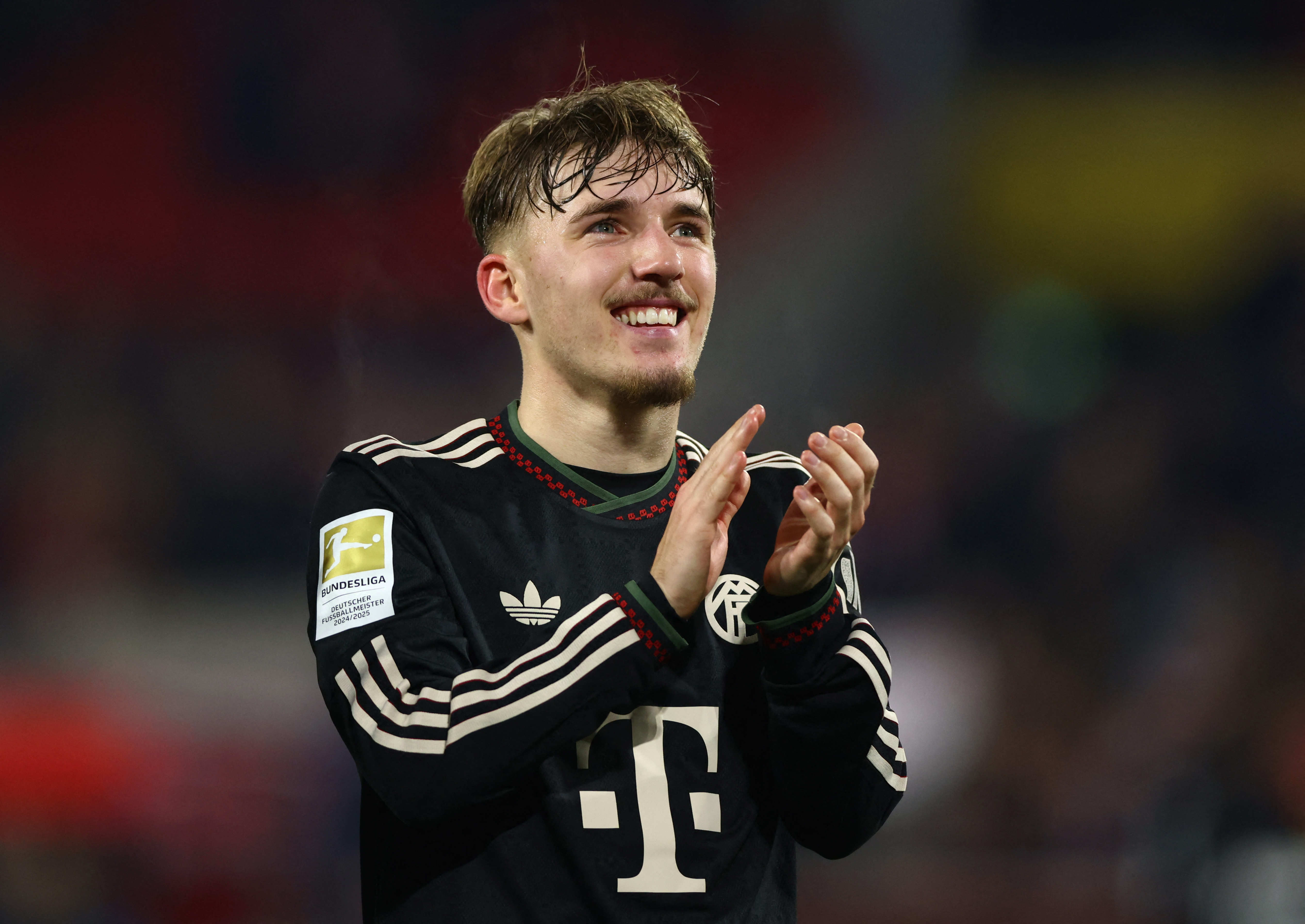Soccer Football - Bundesliga - FC Cologne v Bayern Munich - RheinEnergieStadion, Cologne, Germany - January 14, 2026 Bayern Munich's Lennart Karl applauds fans after the match REUTERS/Thilo Schmuelgen DFL REGULATIONS PROHIBIT ANY USE OF PHOTOGRAPHS AS IMAGE SEQUENCES AND/OR QUASI-VIDEO.