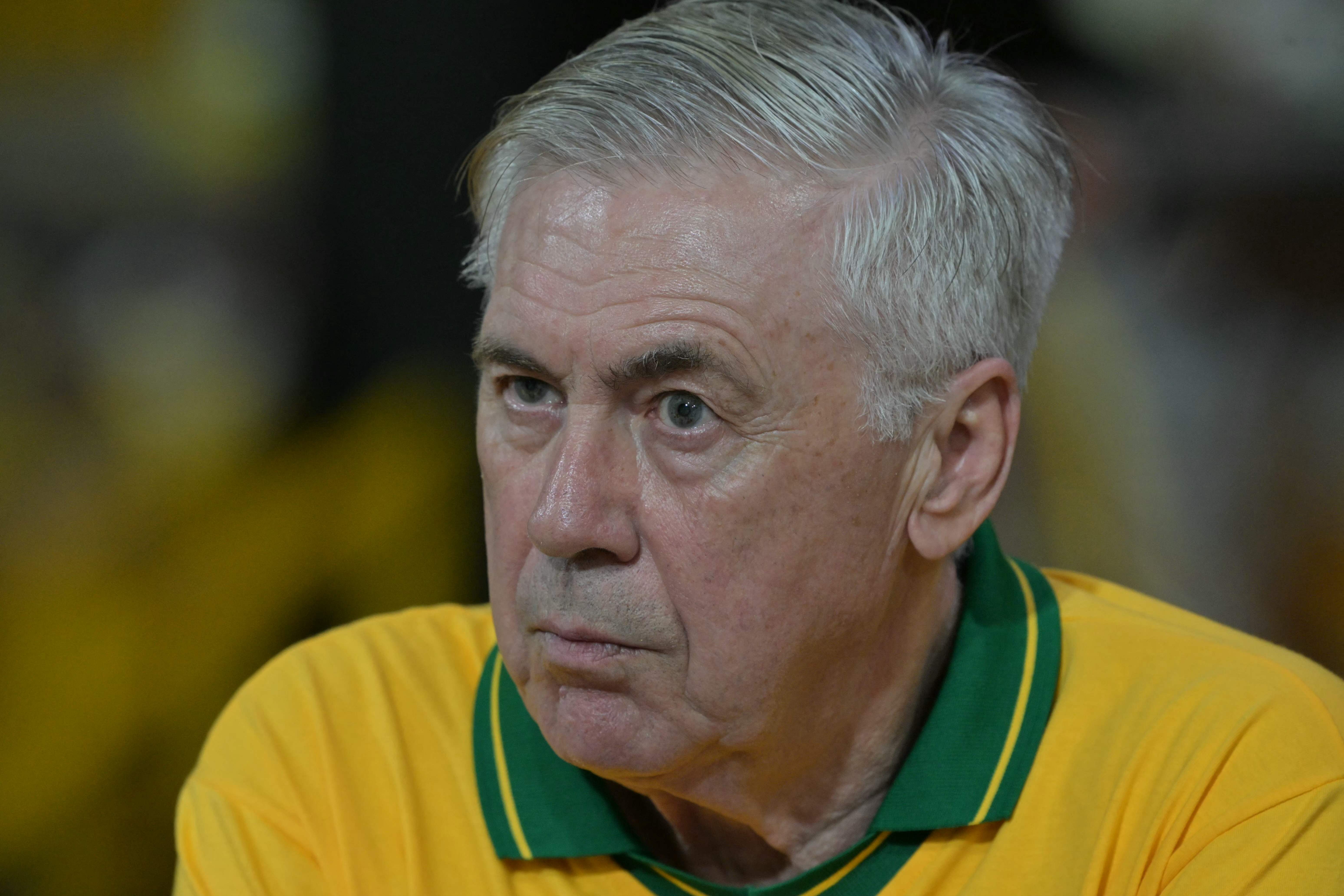 (FILES) Brazil's Italian head coach Carlo Ancelotti gestures while attending the second night of carnival parade in the Sambadrome in Sao Paulo, Brazil, on February 14, 2026. Ahead of his next squad selection, Brazil manager Carlo Ancelotti will attend Santos' league match on March 10, 2026, although star player Neymar will once again be unavailable and cannot be seen in action. Ancelotti will announce his squad on March 16 for the friendly matches against France and Croatia on March 26 and 31 in the United States, in preparation for the 2026 World Cup. (Photo by NELSON ALMEIDA / AFP)