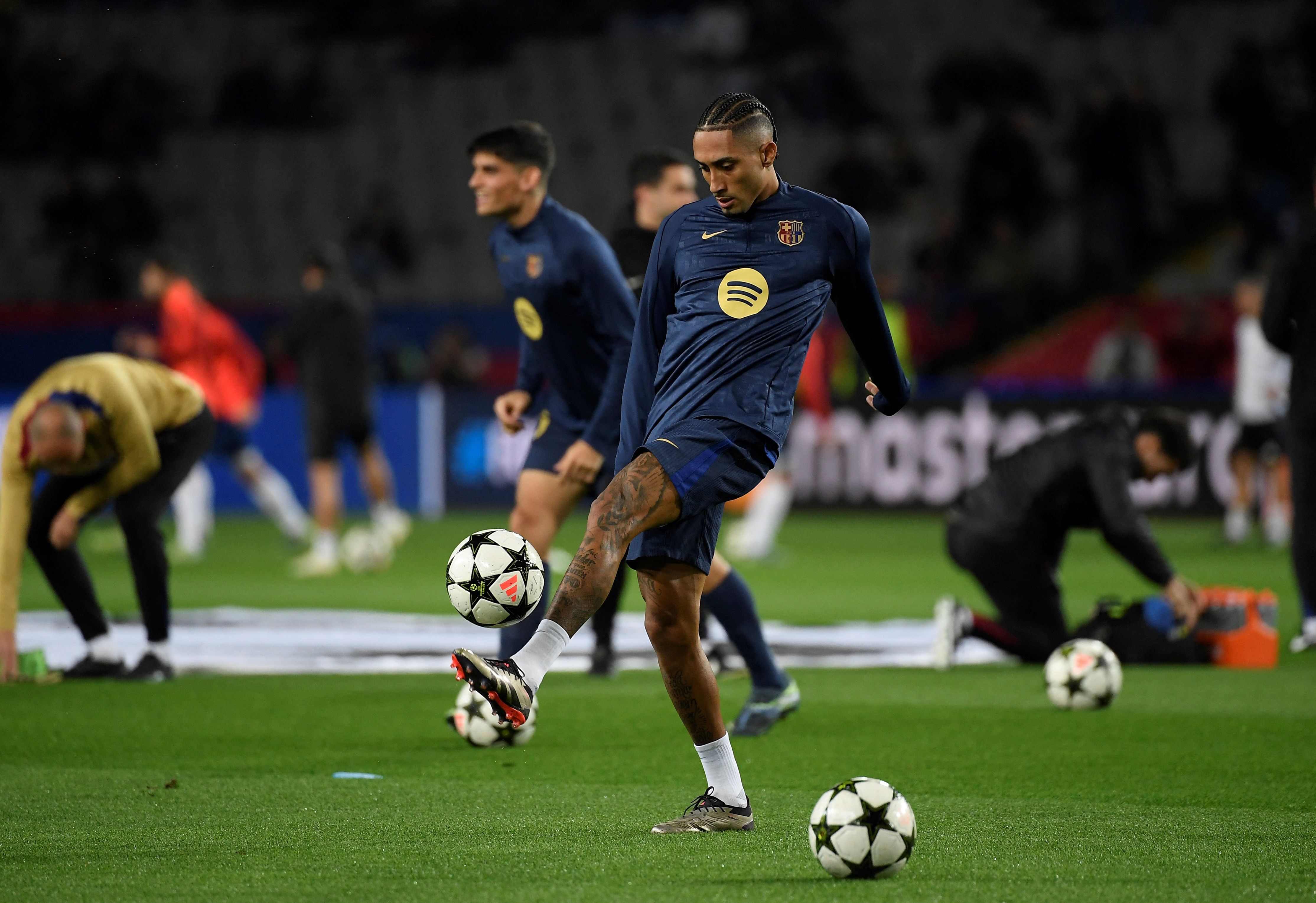 Barcelona's Brazilian forward #11 Raphinha warms up prior the UEFA Champions League, league phase day 5 football match between FC Barcelona and Stade Brestois 29 (Brest) at the Estadi Olimpic Lluis Companys in Barcelona, on November 26, 2024. (Photo by Josep LAGO / AFP)