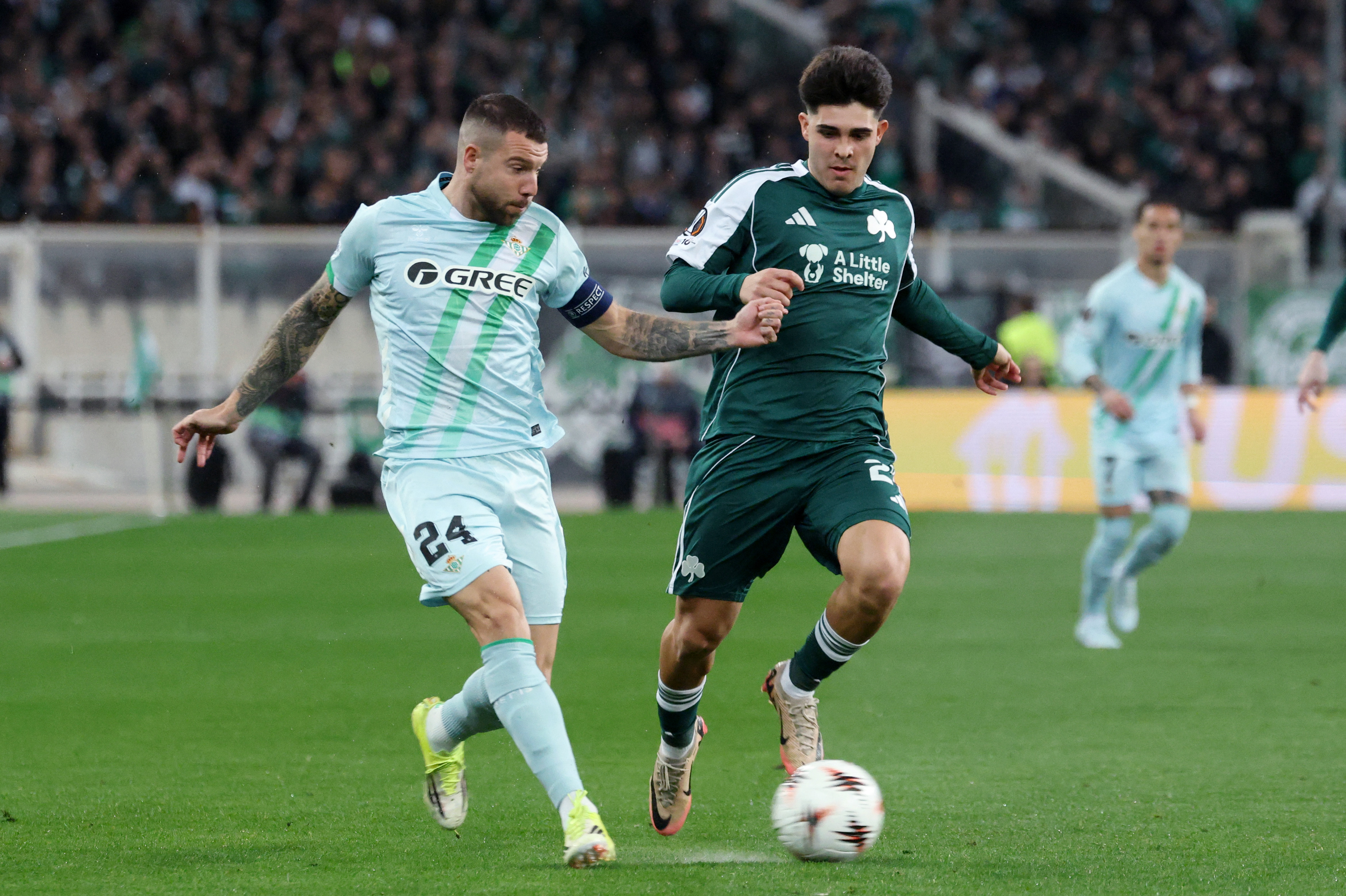 Soccer Football - UEFA Europa League - Round of 16 - First Leg - Panathinaikos v Real Betis - Athens Olympic Stadium, Athens, Greece - March 12, 2026 Real Betis' Aitor Ruibal in action with Panathinaikos' Vicente Taborda REUTERS/Stelios Misinas