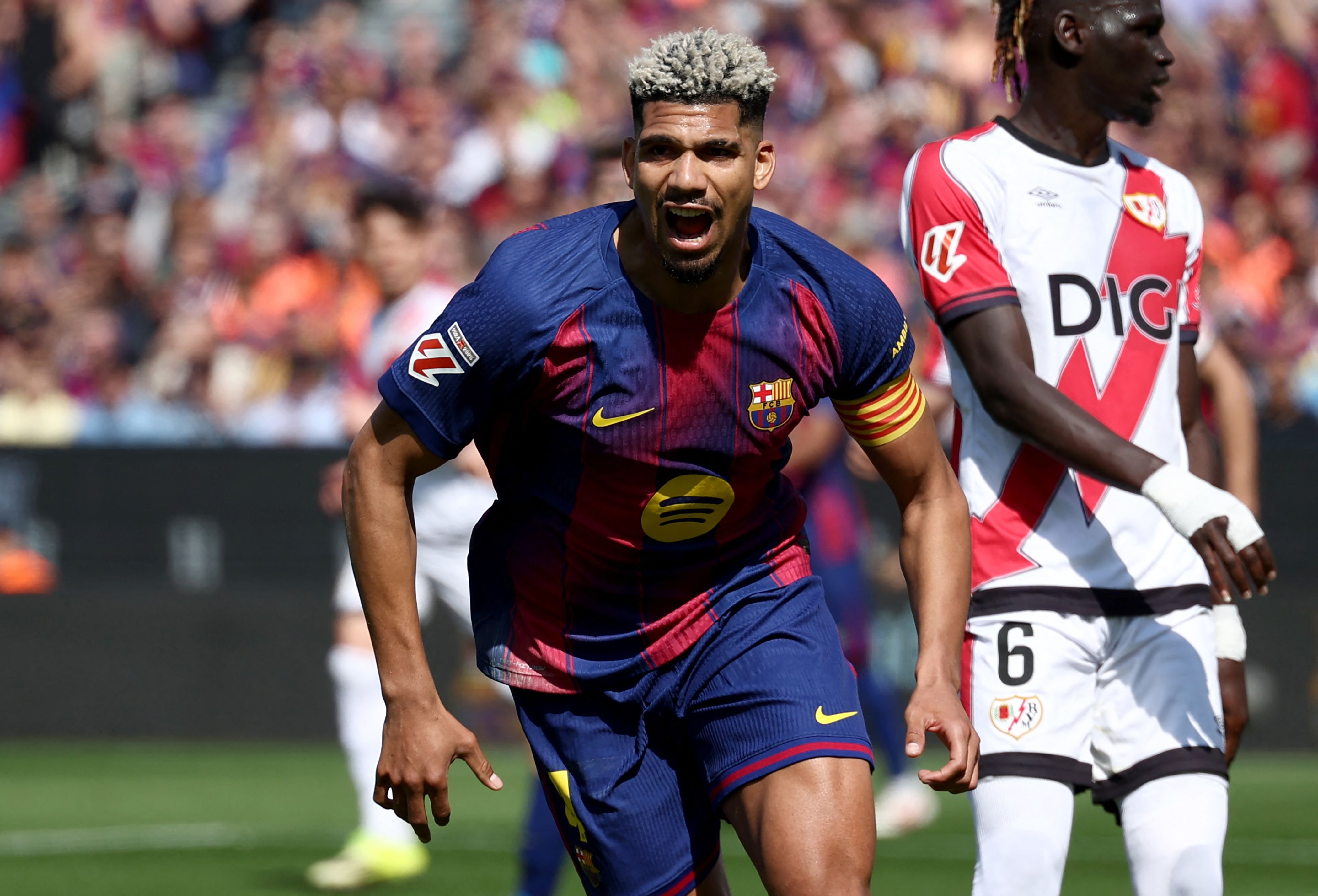 Barcelona edge Rayo Vallecano as Joan García shines to keep LaLiga lead