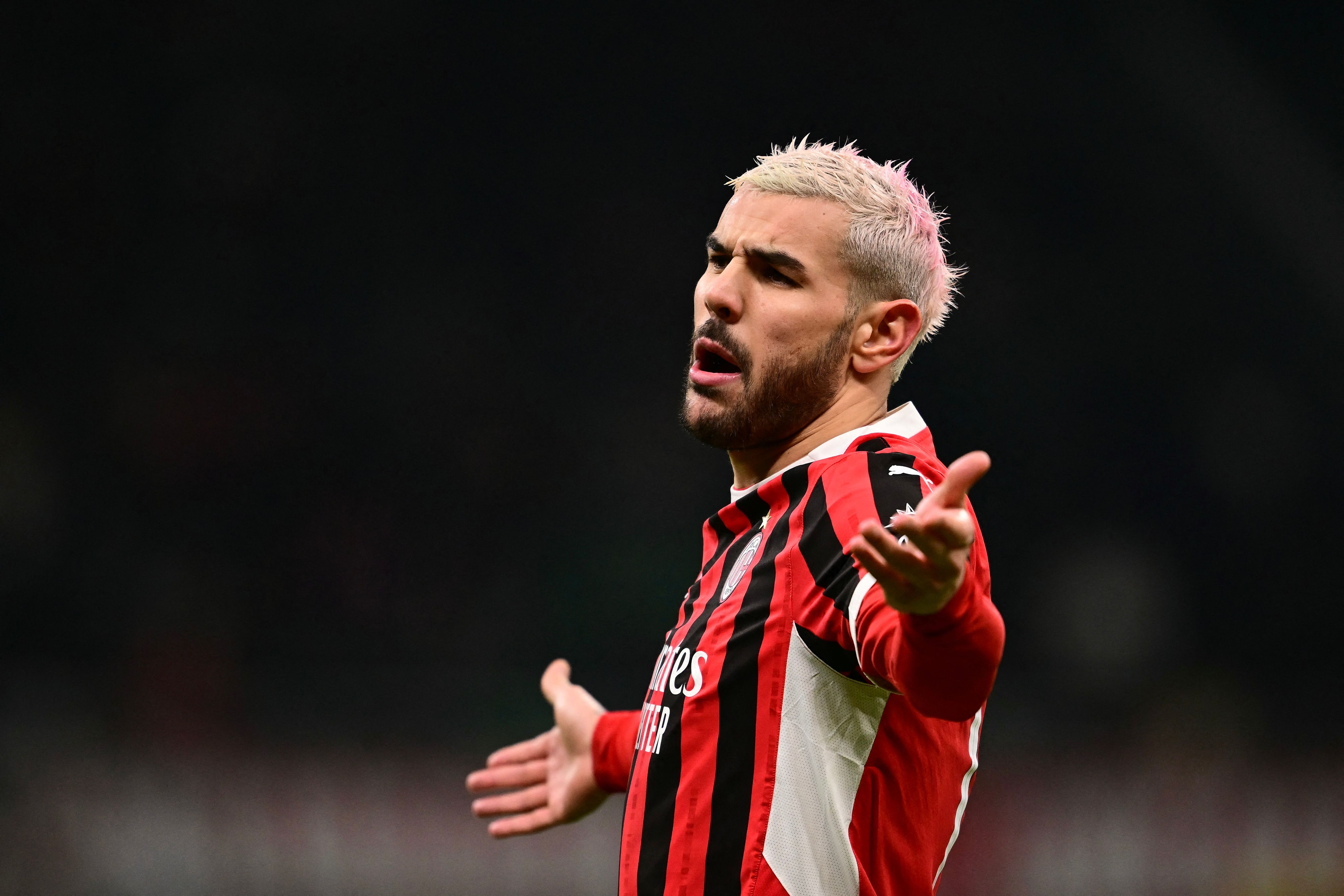 AC Milan's French defender #19 Theo Hernandez reacts during the UEFA Champions League knockout round play-off second leg football match between AC Milan and Feyenoord at San Siro stadium in Milan, on February 18, 2025. (Photo by Marco BERTORELLO / AFP)