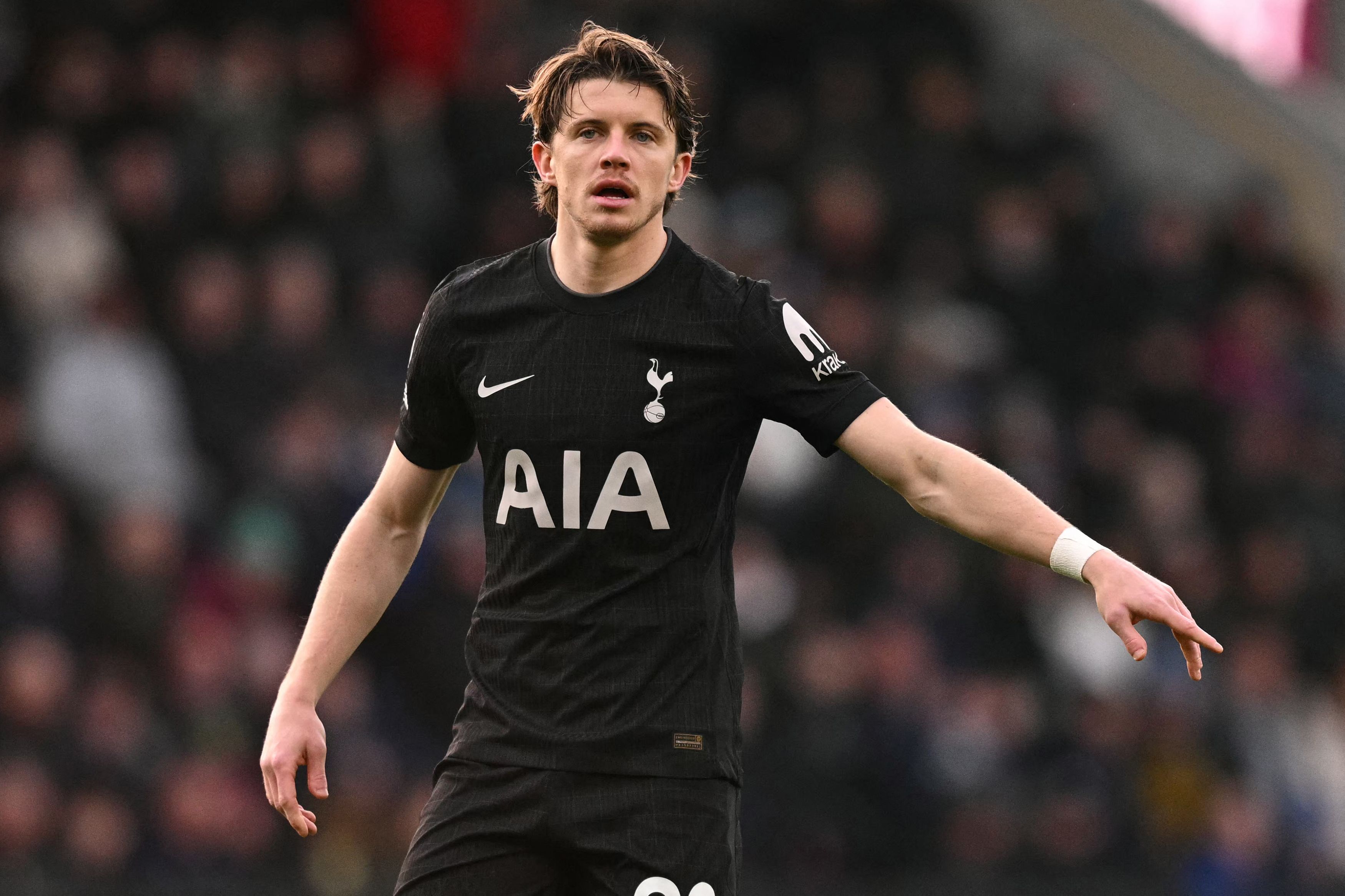 Tottenham Hotspur's English midfielder #22 Conor Gallagher gestures during the English Premier League football match between Burnley and Tottenham Hotspur at Turf Moor in Burnley, north-west England on January 24, 2026. (Photo by Oli SCARFF / AFP) / RESTRICTED TO EDITORIAL USE. No use with unauthorized audio, video, data, fixture lists, club/league logos or 'live' services. Online in-match use limited to 120 images. An additional 40 images may be used in extra time. No video emulation. Social media in-match use limited to 120 images. An additional 40 images may be used in extra time. No use in betting publications, games or single club/league/player publications. /
