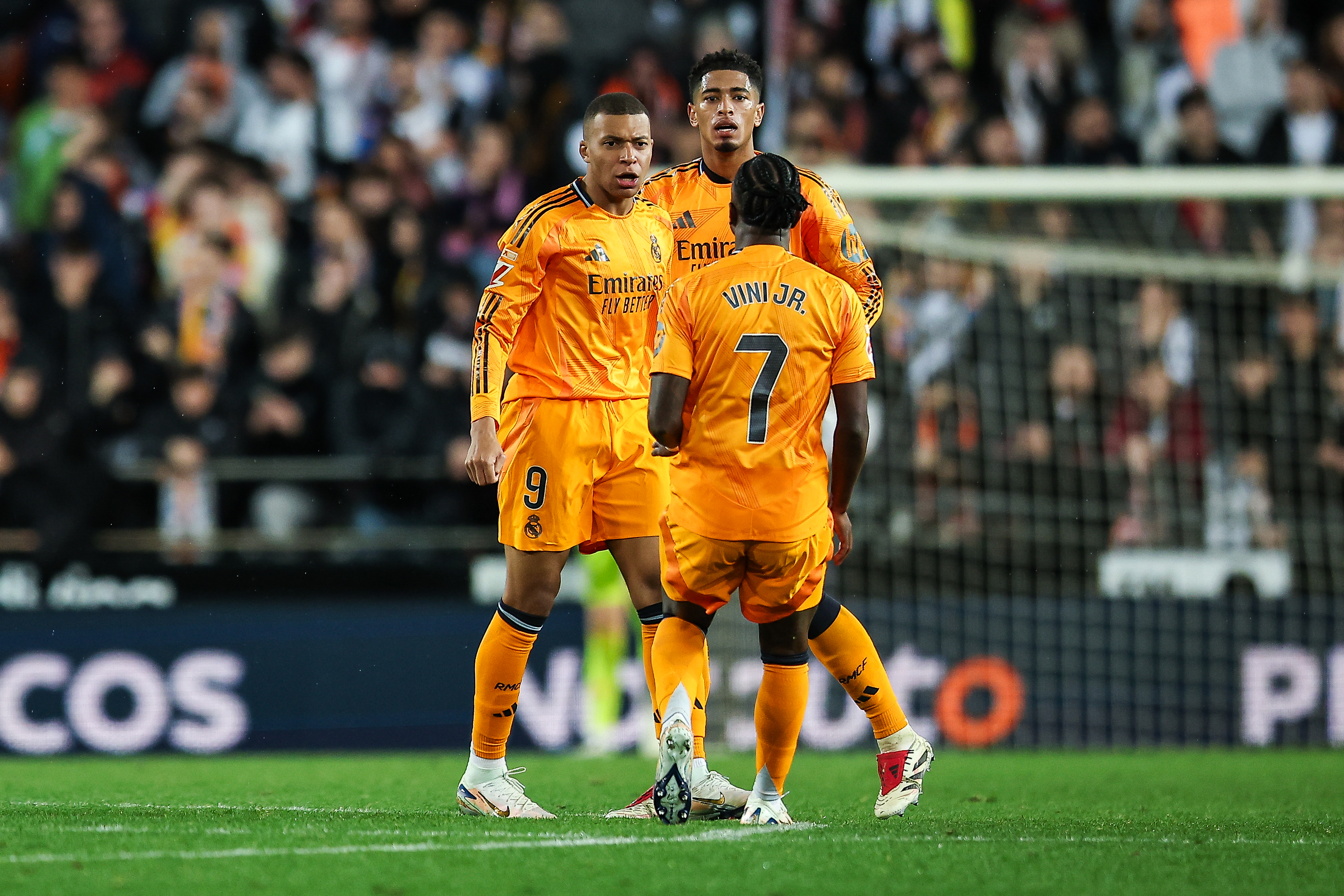 VALENCIA, SPAIN - JANUARY 03: Kylian Mbappe of Real Madrid reacts with Jude Bellingham and Vinicius Junior of Real Madrid after scoring but his goal will be canceled during the LaLiga match between Valencia CF and Real Madrid CF at Estadio Mestalla on January 03, 2025 in Valencia, Spain. (Photo by Eric Alonso/Getty Images)