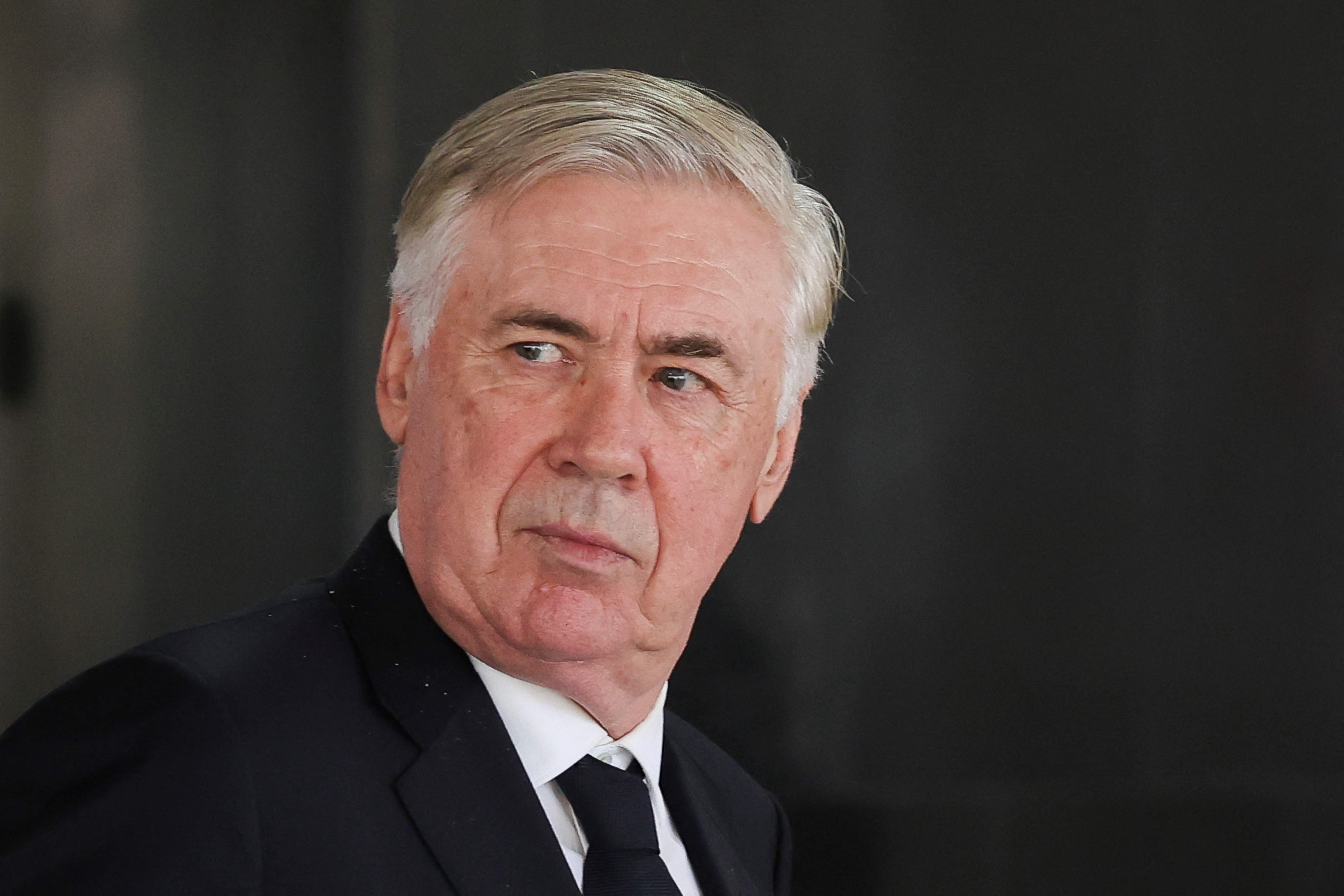 Brazil national team coach Carlo Ancelotti reacts after leaving a meeting with Brazil's President Luiz Inacio Lula da Silva at the Planalto Palace in Brasilia on January 26, 2026. The meeting addressed preparations and government guarantees for the 2027 FIFA Women's World Cup, which will be hosted exclusively by Brazil. The meeting strengthens cooperation between the Brazilian government and sports entities for the promotion of women's football in the country. (Photo by Sergio Lima / AFP)