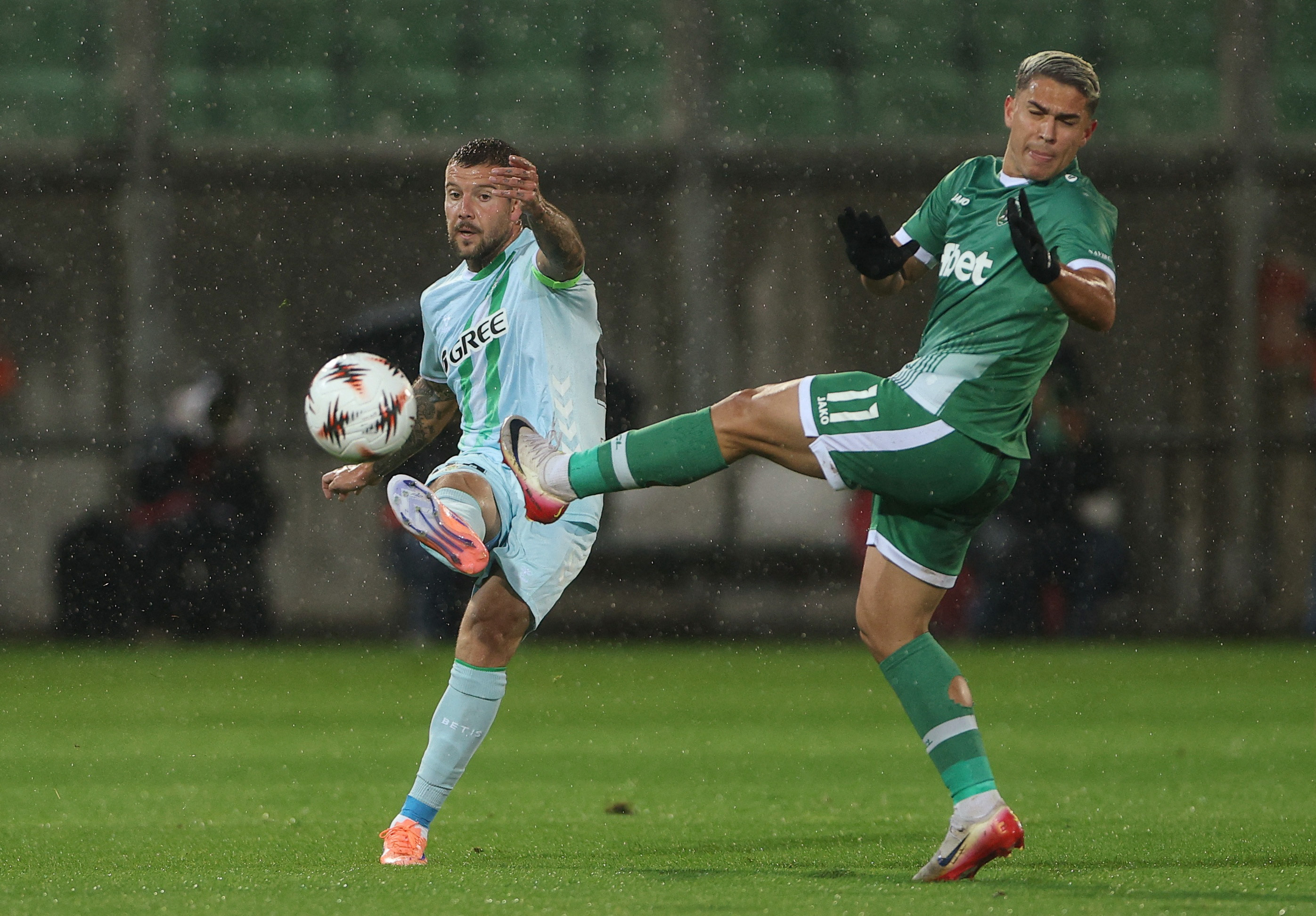 Soccer Football - UEFA Europa League - Ludogorets Razgrad v Real Betis - Ludogorets Arena, Razgrad, Bulgaria - October 2, 2025 Real Betis's Aitor Ruibal in action with Ludogorets Razgrad's Caio REUTERS/Stoyan Nenov