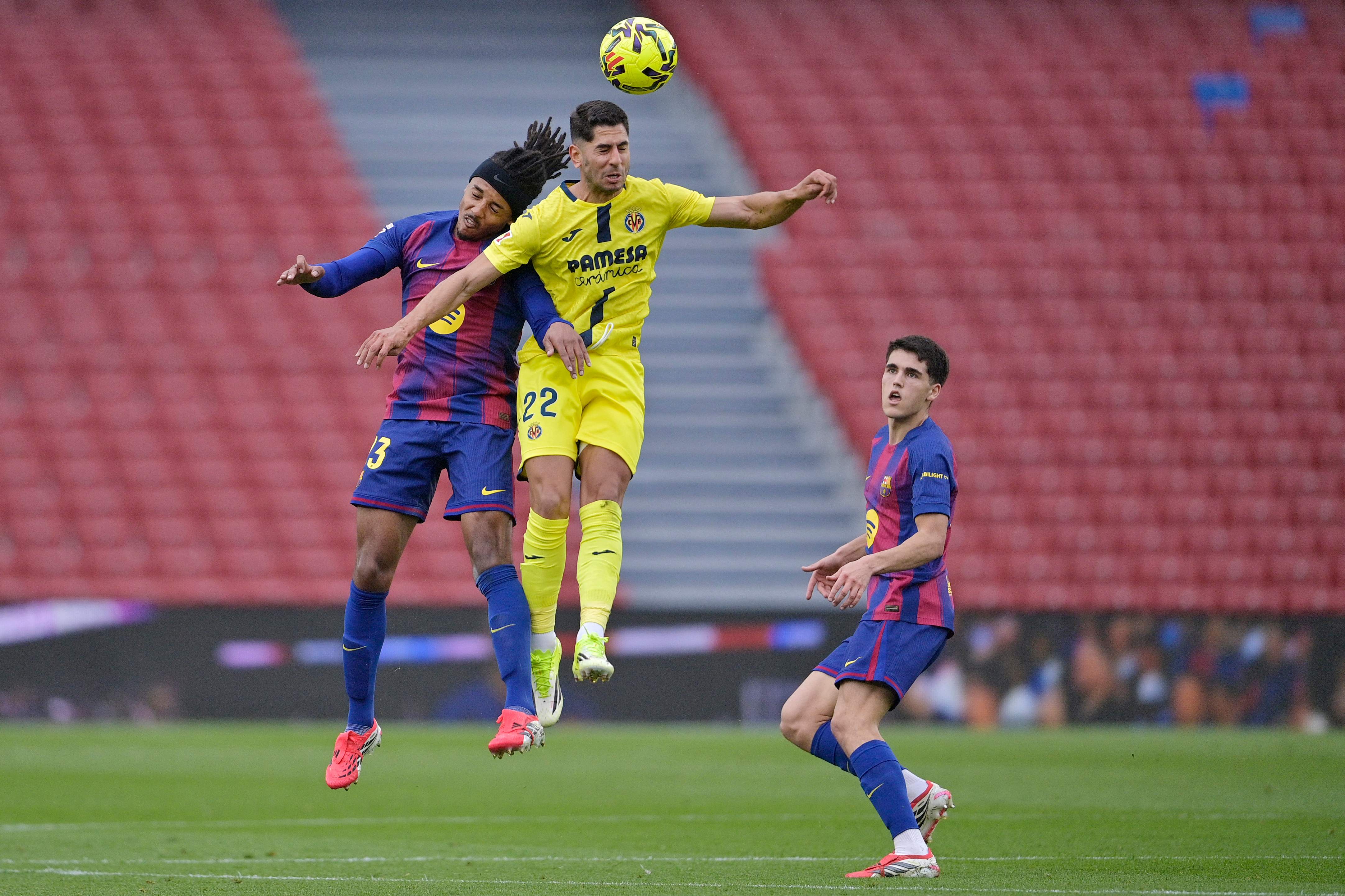 Barcelona's Spanish defender #05 Pau Cubarsi (R) looks at Barcelona's French defender #23 Jules Kounde and Villarreal's Spanish forward #22 Ayoze Perez Gutierrez fighting foir a header during the Spanish league football match between FC Barcelona and Villarreal CF at Camp Nou Stadium in Barcelona on February 28, 2026. (Photo by MANAURE QUINTERO / AFP)