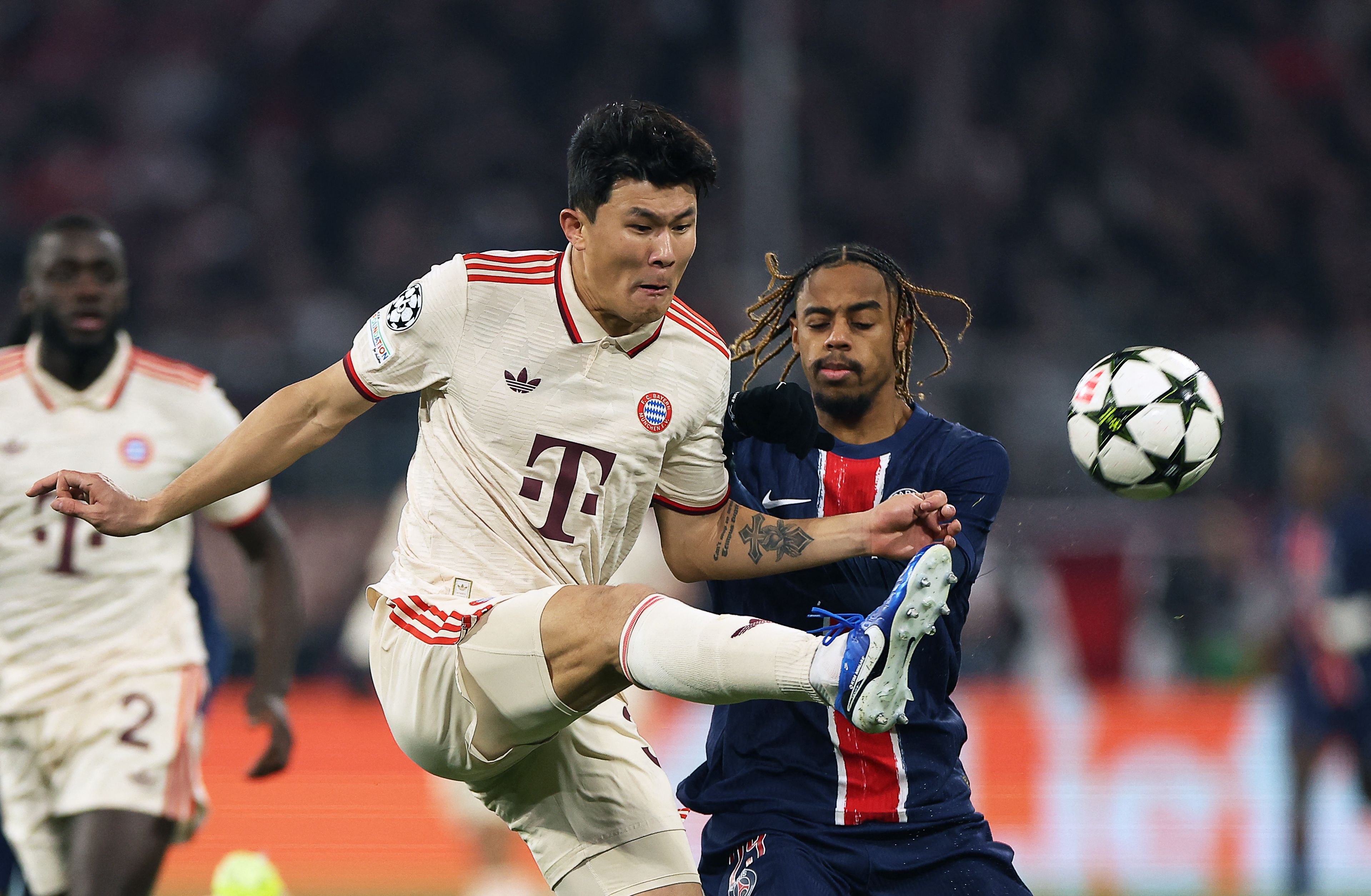 Bayern Munich's South Korean defender #03 Kim�Min-Jae (L) fights for the ball with Paris Saint-Germain's French forward #29 Bradley Barcola during the UEFA Champions League, League phase - Matchday 5, football match between FC Bayern Munich Paris Saint-Germain (PSG) in Munich, southern Germany, on November 26, 2024. (Photo by FRANCK FIFE / AFP)
