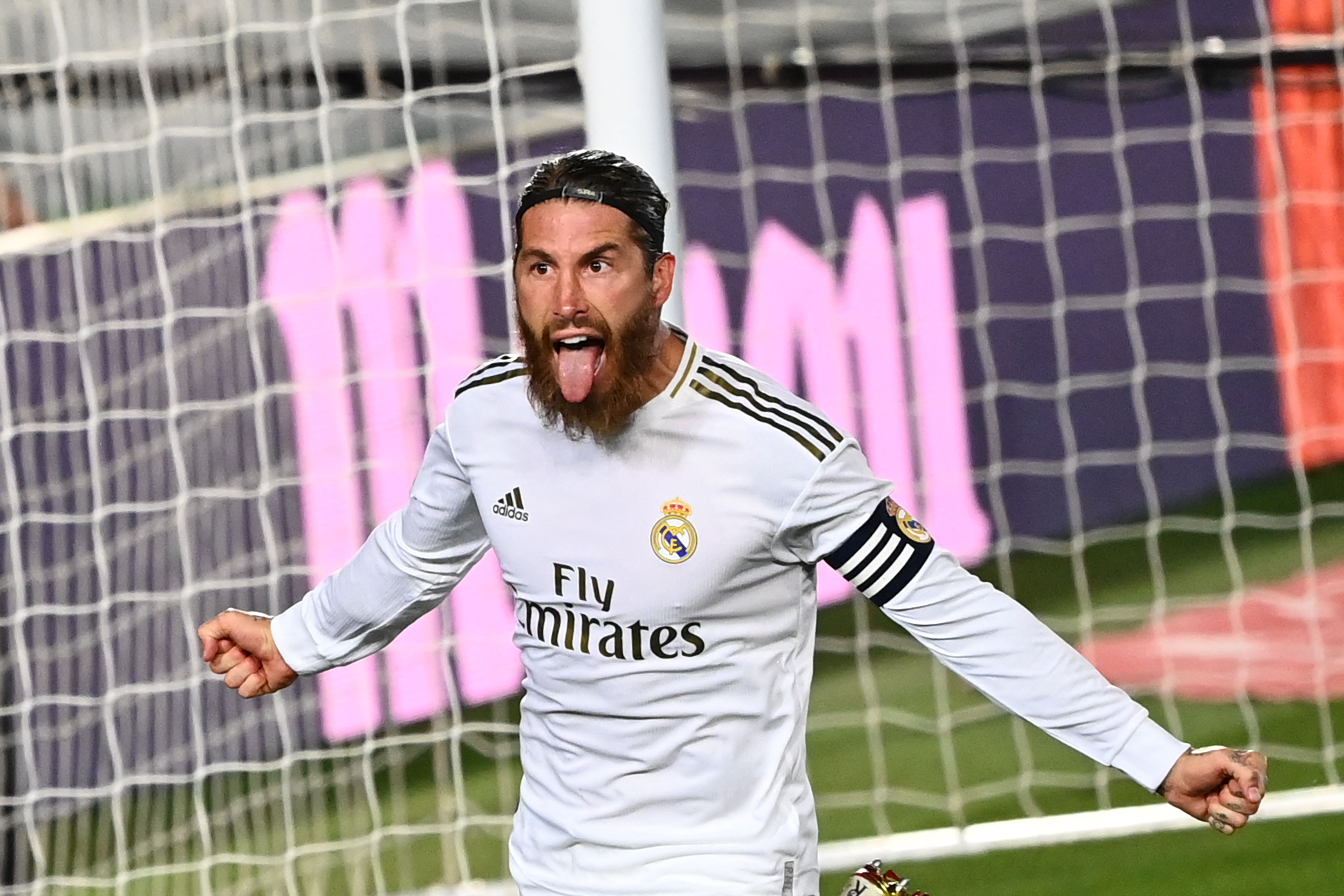 (FILES) In this file photo taken on July 02, 2020 Real Madrid's Spanish defender Sergio Ramos celebrates after scoring during the Spanish league football match Real Madrid CF againsrt Getafe CF at the Alfredo di Stefano stadium in Valdebebas, on the outskirts of Madrid. - Legendary captain Sergio Ramos is to leave Real Madrid after a glittering, trophy-laden career spanning 671 games and 16 seasons, the club announced on June 16, 2021. (Photo by GABRIEL BOUYS / AFP)