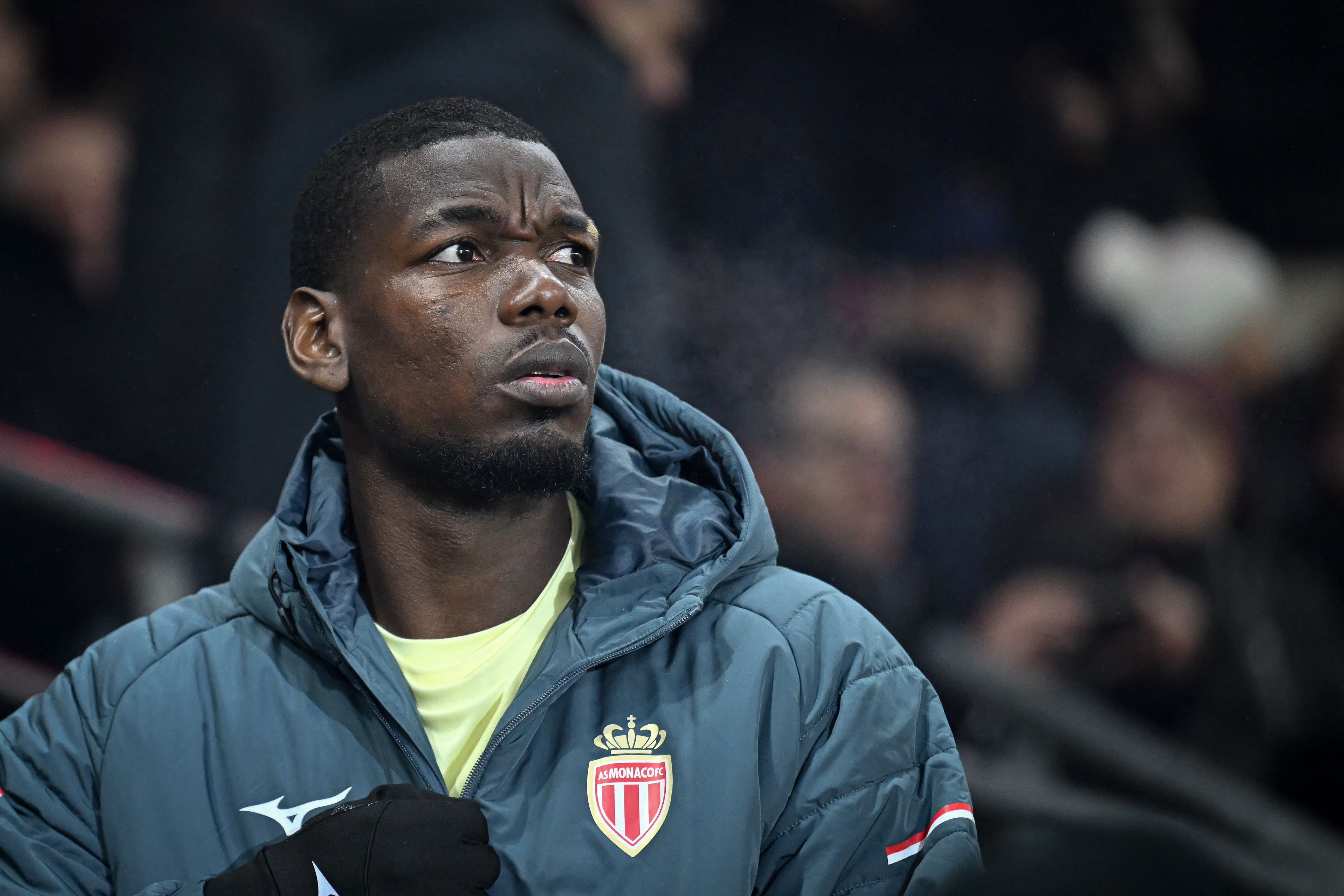 Monaco�s French midfielder #08 Paul Pogba looks on ahead of the French L1 football match between Stade Rennais FC and AS Monaco at the Roazhon Park stadium in Rennes, western France, on November 22, 2025. (Photo by Lou BENOIST / AFP)