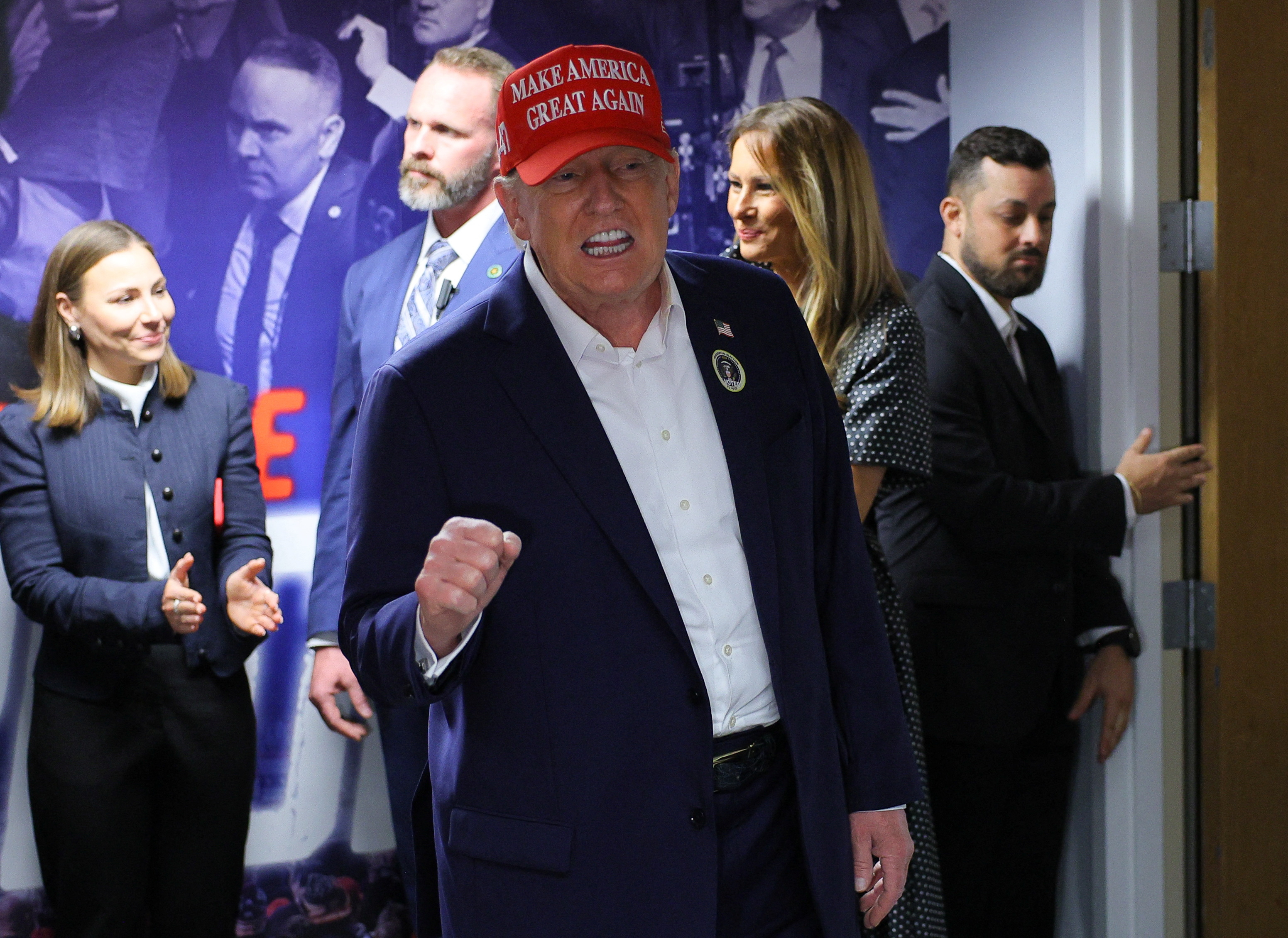 Republican presidential nominee and former U.S. President Donald Trump, accompanied by former U.S. first lady Melania Trump, visits his campaign headquarters to thank the campaign workers on Election Day, in West Palm Beach, Florida, U.S., November 5, 2024. REUTERS/Brian Snyder