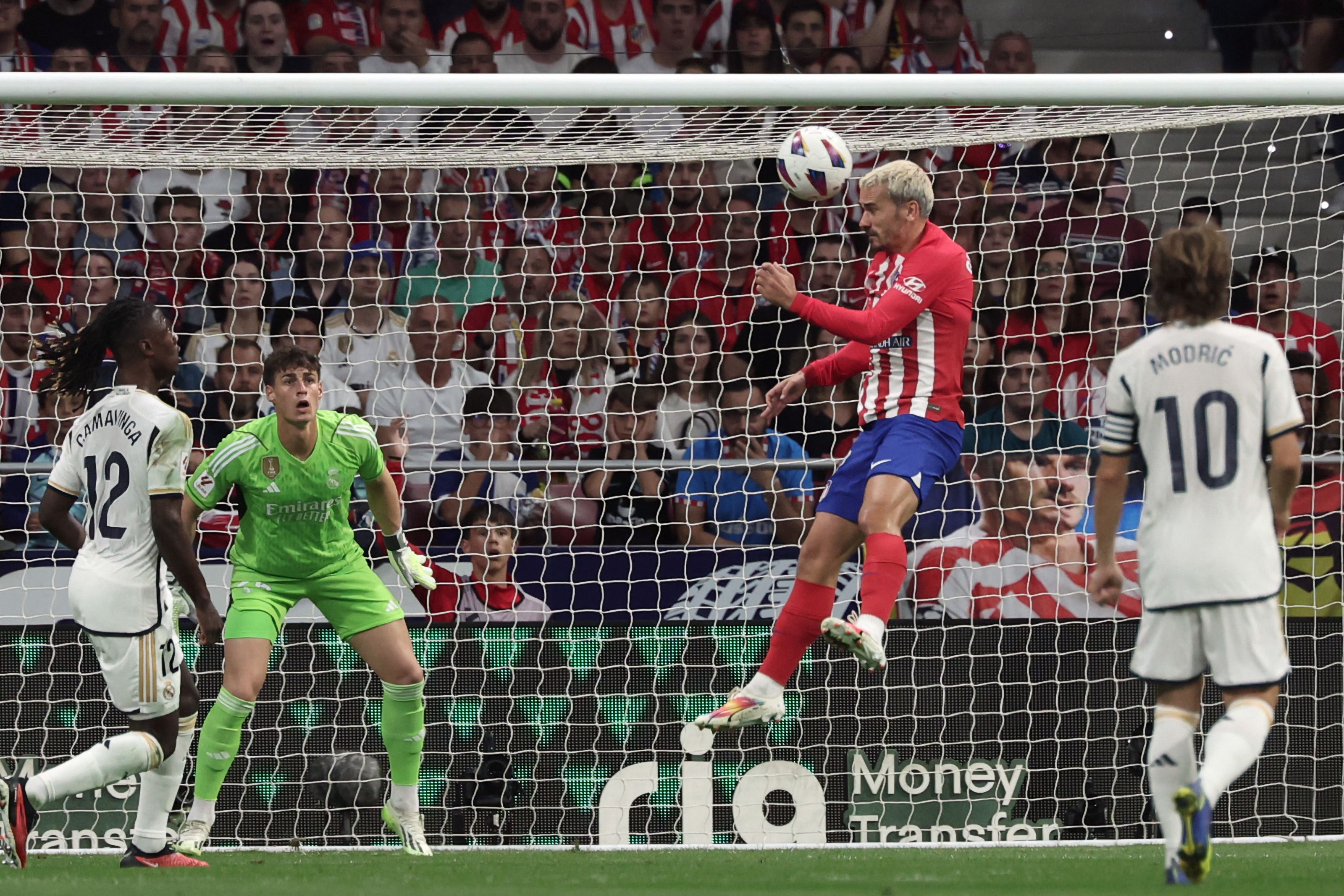 Atletico Madrid's French forward #07 Antoine Griezmann (2R) scores his team's second goal during the Spanish Liga football match between Club Atletico de Madrid and Real Madrid CF at the Metropolitano stadium in Madrid on September 24, 2023. (Photo by Thomas COEX / AFP)