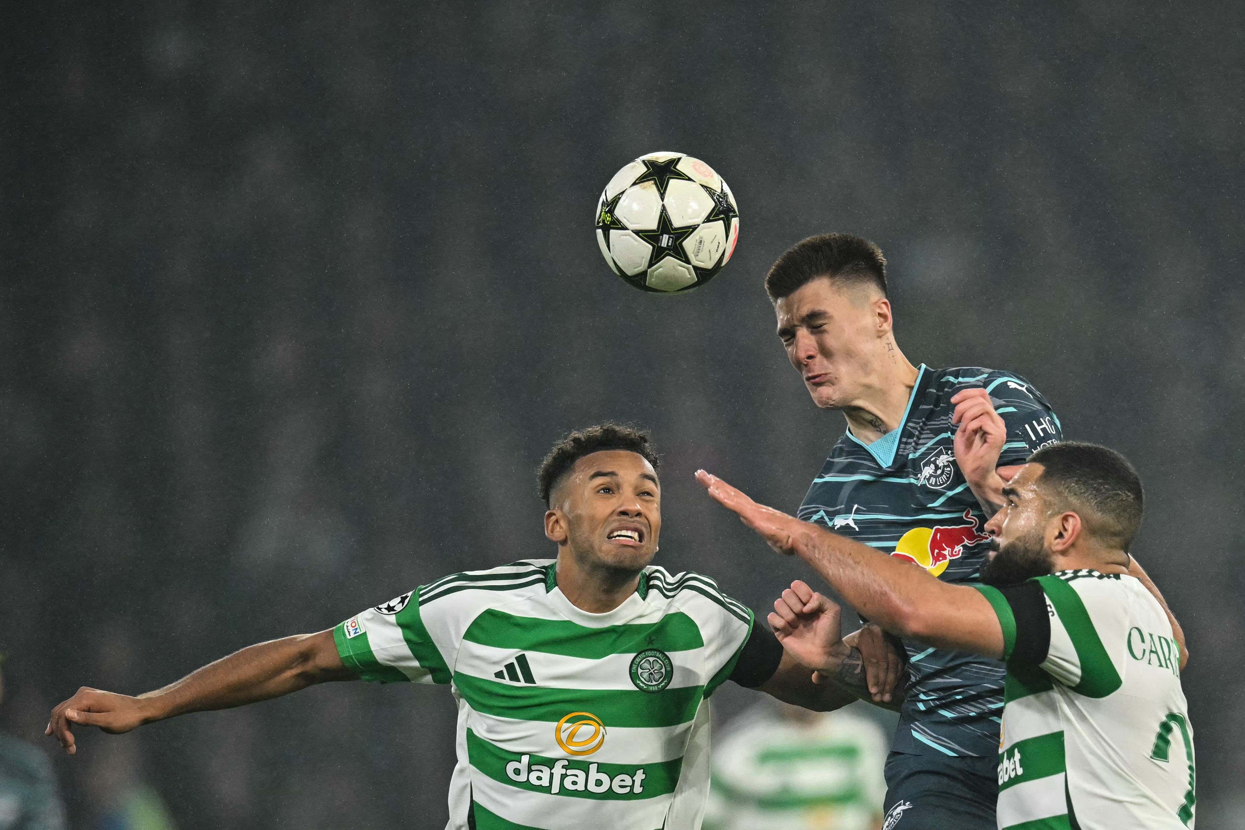 (From L) Celtic's US defender #06 Auston Trusty, Leipzig's Slovenian forward #30 Benjamin Sesko and Celtic's US defender #20 Cameron Carter-Vickers fight f during the UEFA Champions League football match between Celtic and RB Leipzig at Celtic Park stadium, in Glasgow, Scotland, on November 5, 2024. (Photo by ANDY BUCHANAN / AFP)