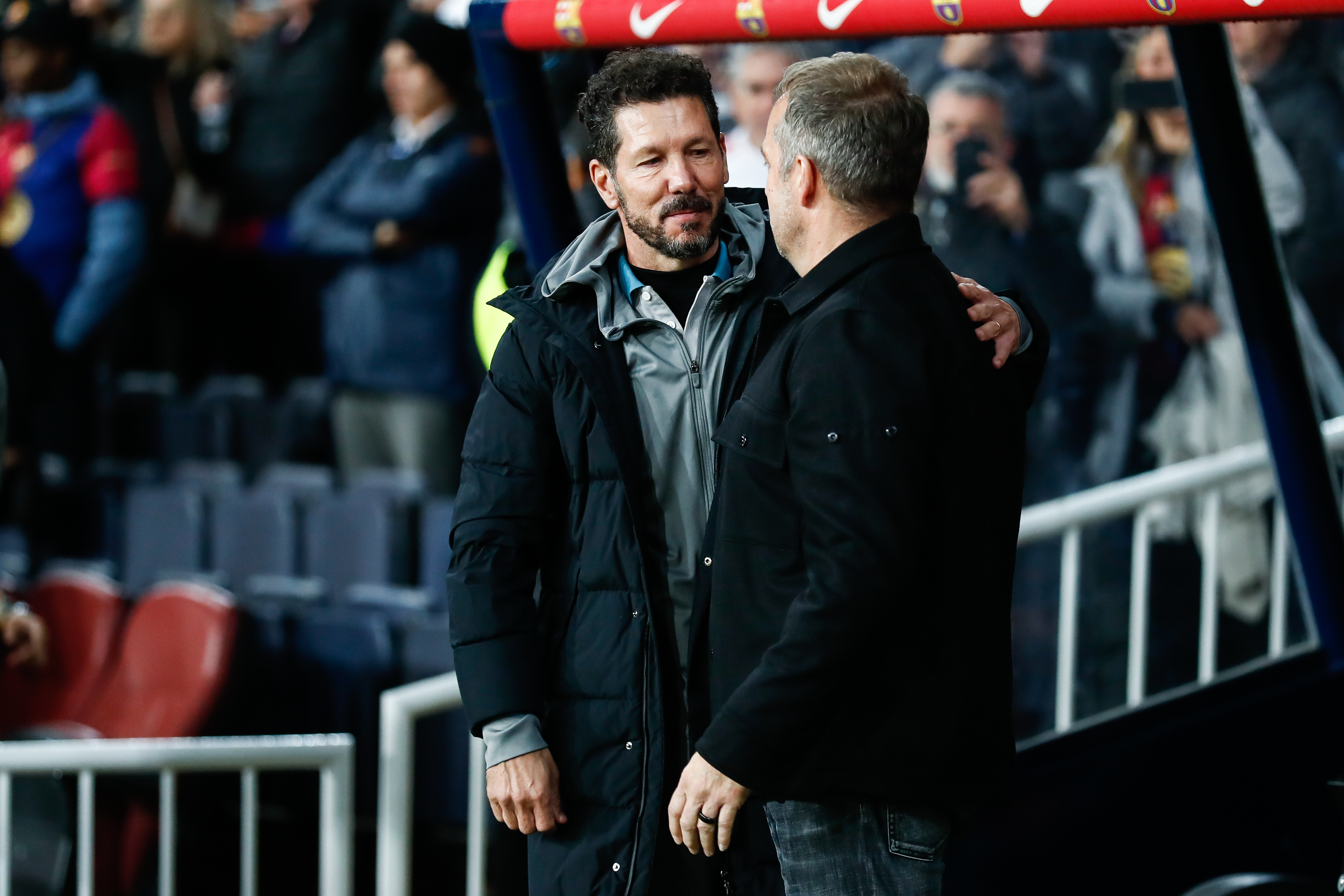 BARCELONA, SPAIN - FEBRUARY 25: Diego Pablo Simeone, head coach of Atletico de Madrid, and Hansi Flick, head coach of FC Barcelona, greet each other during the Spanish Cup, Copa del Rey, semi-final football match played between FC Barcelona and Atletico de Madrid at Estadi Olimpic Lluis Companys on February 25, 2025 in Barcelona, Spain. (Photo By Irina R. Hipolito/Europa Press via Getty Images)