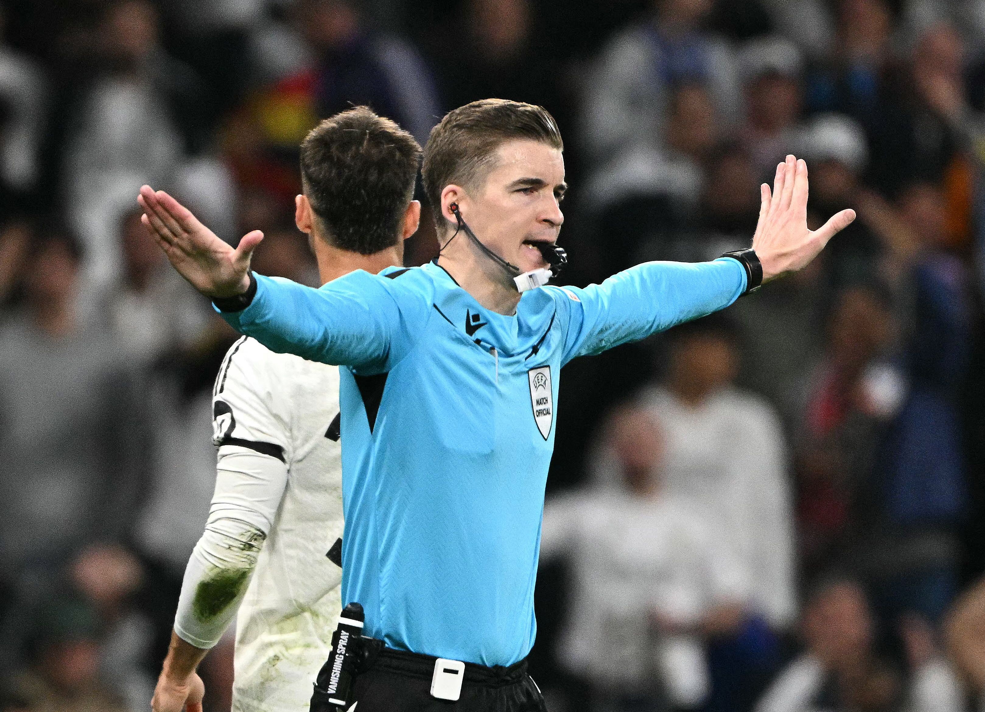 French referee Francois Letexier gestures as a penalty is cancelled during the UEFA Champions League quarter final second leg football match between Real Madrid CF and Arsenal at Santiago Bernabeu Stadium in Madrid on April 16, 2025. (Photo by JAVIER SORIANO / AFP)