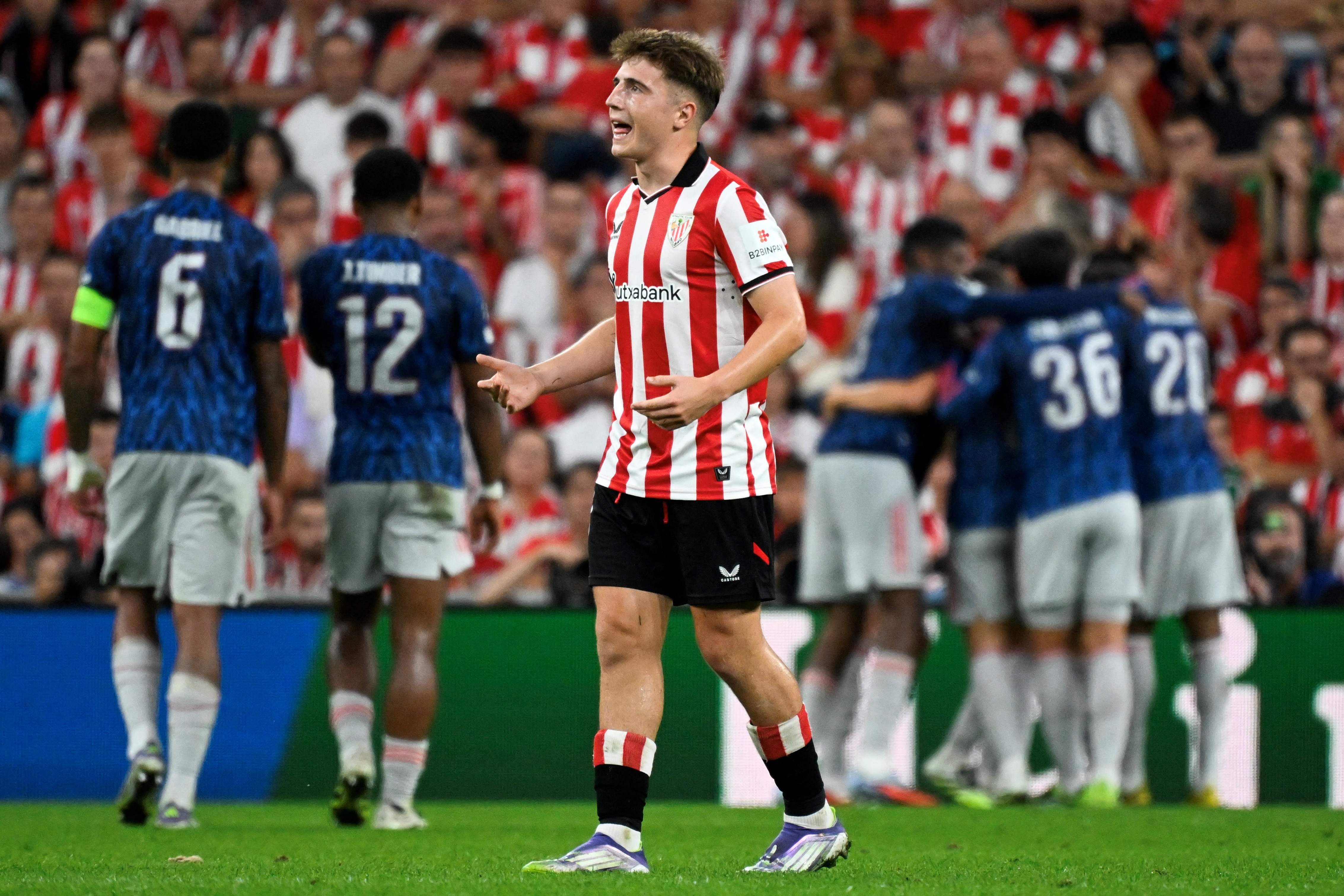 Athletic Bilbao's Spanish midfielder #18 Mikel Jauregizar Alboniga reacts after Arsenal's first goal during the UEFA Champions League first round day 1 football match between Athletic Club Bilbao and Arsenal at the San Mames stadium in Bilbao on September 16, 2025. (Photo by ANDER GILLENEA / AFP)