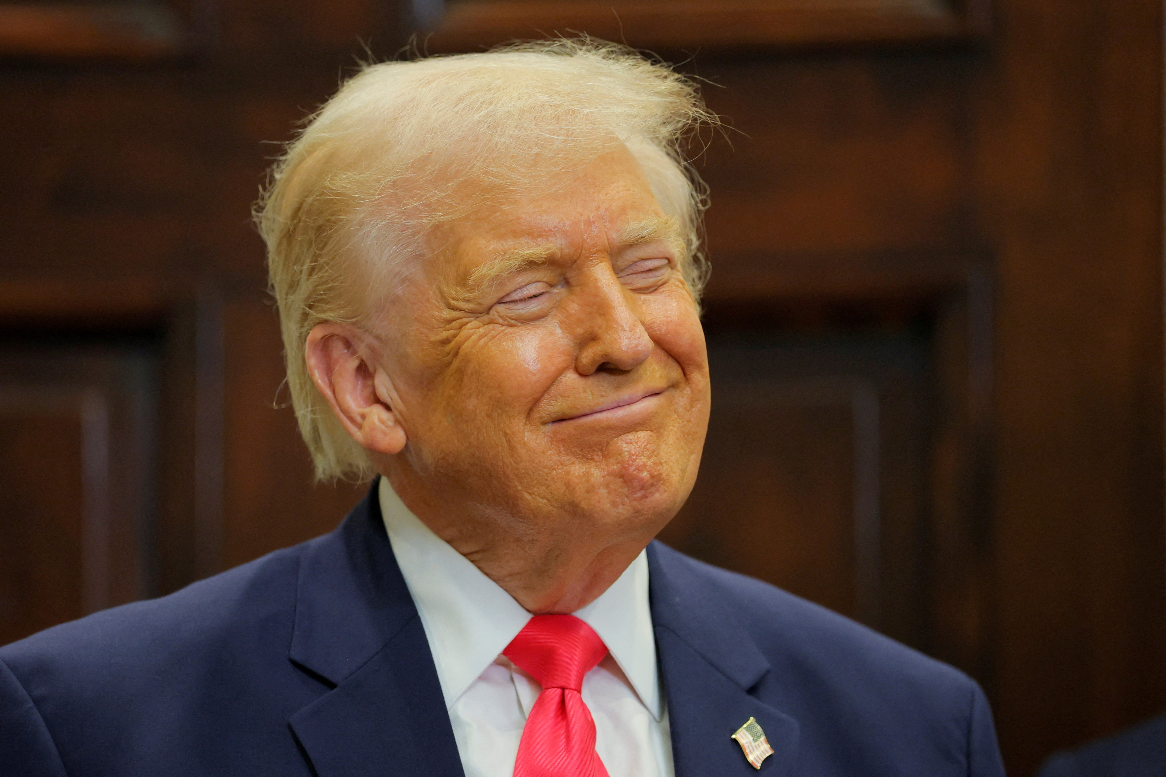 FILE PHOTO: U.S. President Donald Trump smiles during an announcement about "Trump accounts", in the Roosevelt Room at the White House in Washington, D.C., U.S., December 2, 2025. REUTERS/Brian Snyder/File Photo