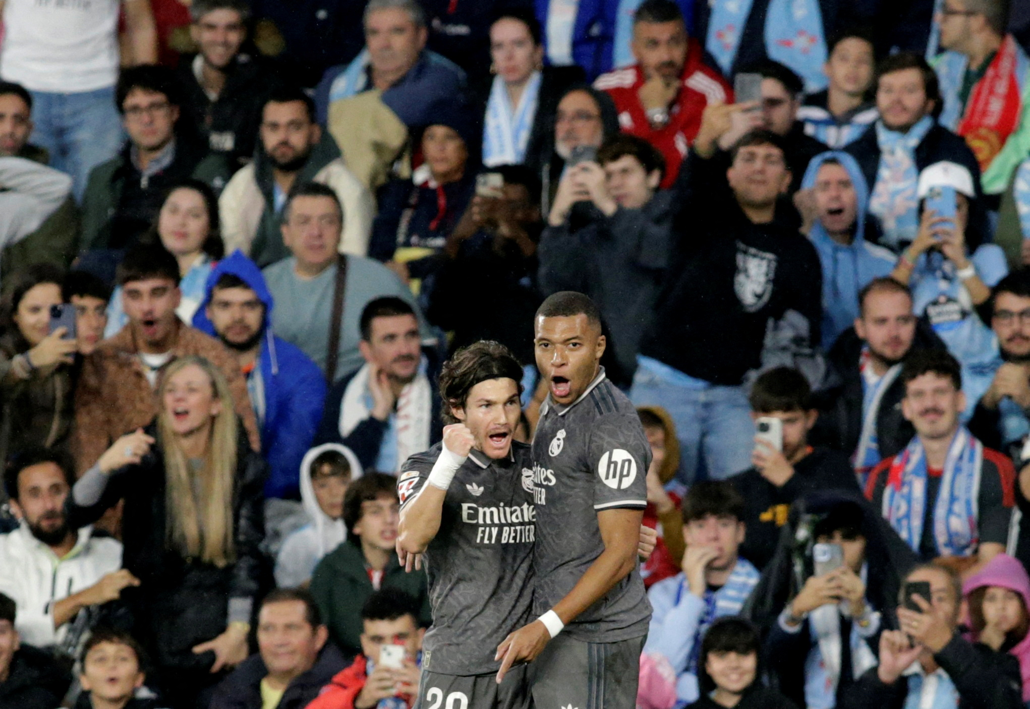 Soccer Football - LaLiga - Celta Vigo v Real Madrid - Estadio de Balaidos, Vigo, Spain - October 19, 2024 Real Madrid's Kylian Mbappe celebrates scoring their first goal with Fran Garcia REUTERS/Miguel Vidal     TPX IMAGES OF THE DAY