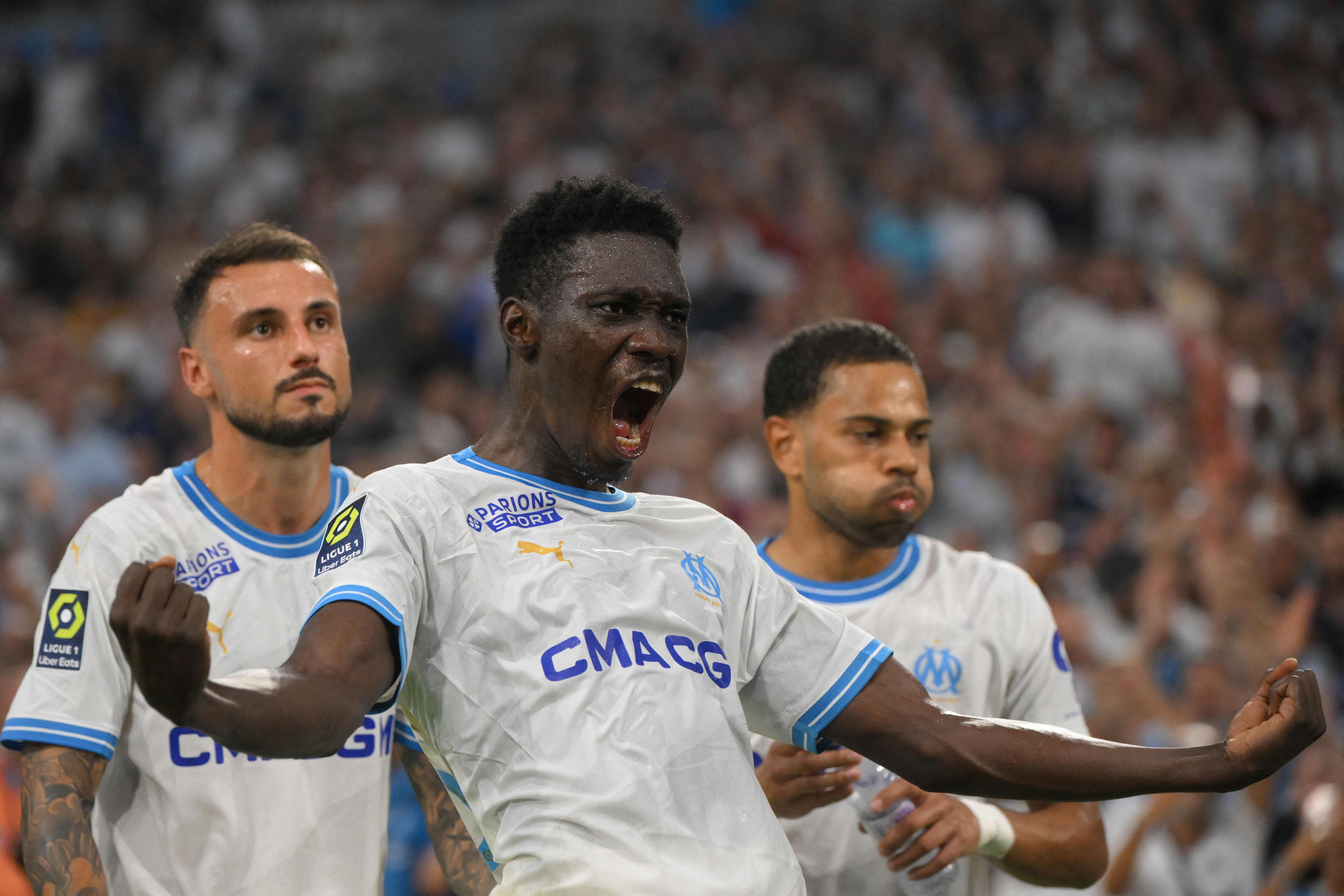 Marseille's Senegalese forward #23 Ismaila Sarr (C) celebrates after scoring the team's second goal during the French L1 football match between Olympique de Marseille (OM) and Brest at the Velodrome stadium in Marseille, southern France, on August 26, 2023. (Photo by Nicolas TUCAT / AFP)