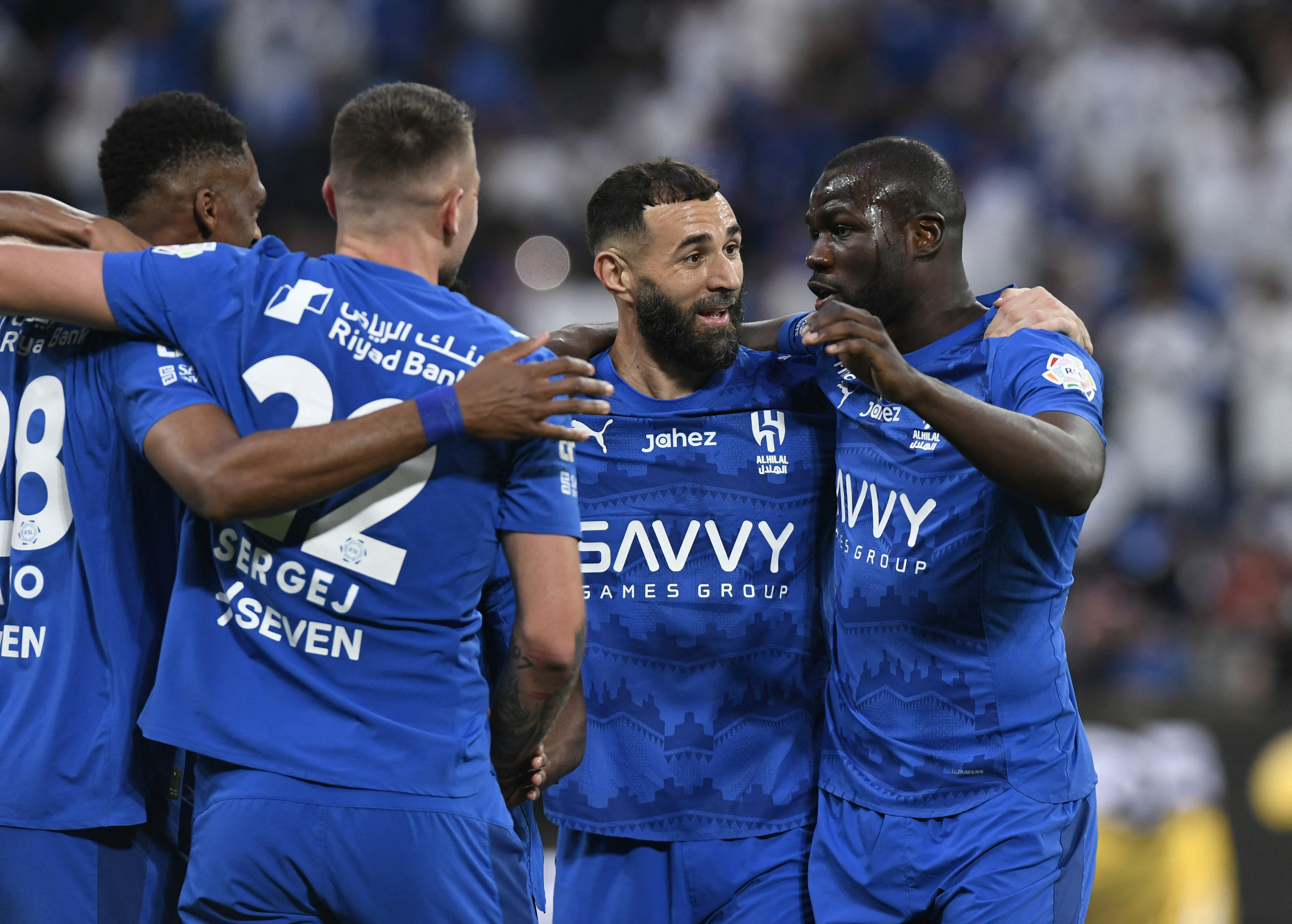 Soccer Football - Saudi Pro League - Al Hilal v Al Ettifaq - Kingdom Arena, Riyadh, Saudi Arabia - February 13, 2026 Al Hilal's Mohamed Kanno celebrates scoring their first goal with Karim Benzema and teammates REUTERS/Stringer