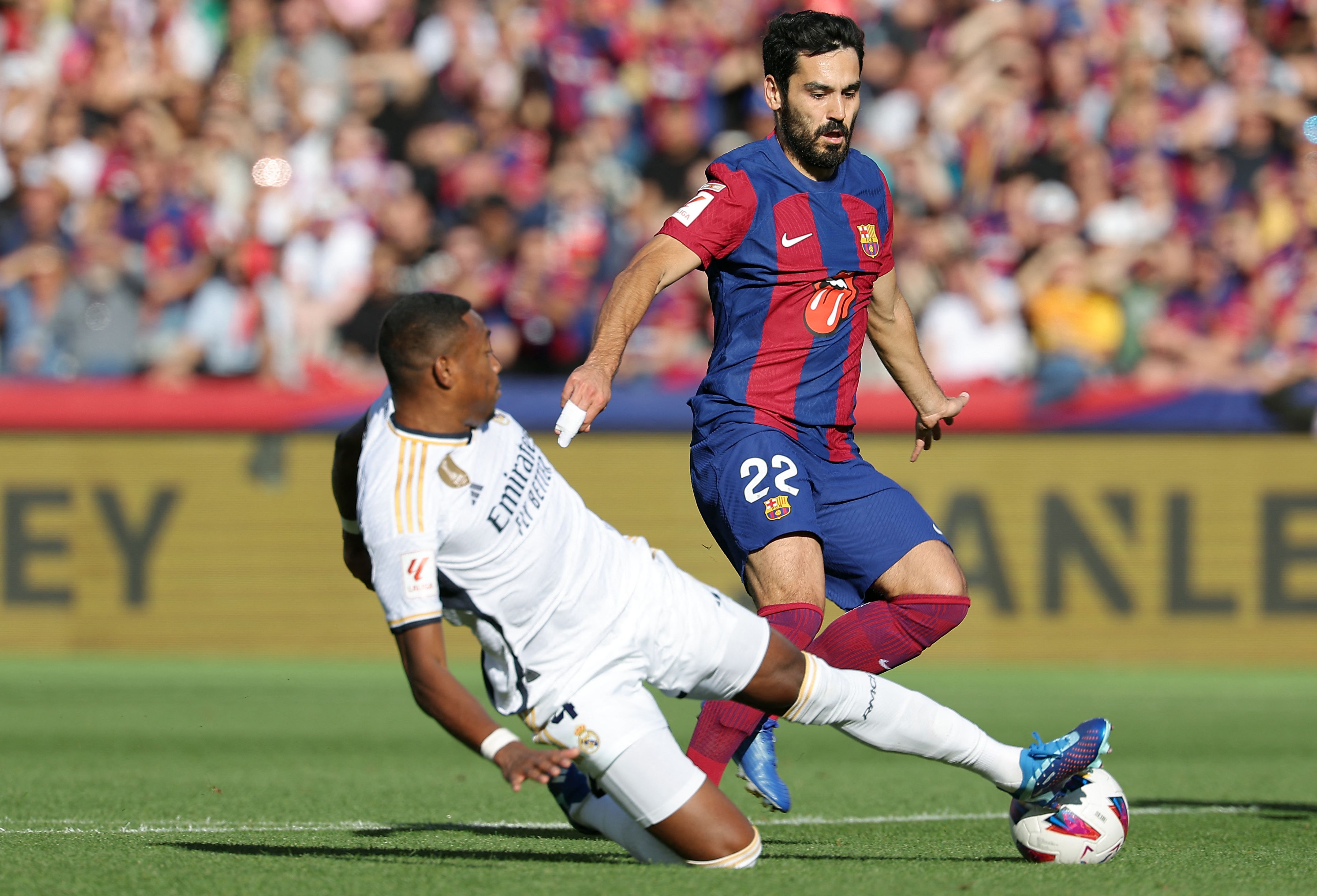 Mick Jagger and Ronnie Wood attend 'El Clasico' Spanish football