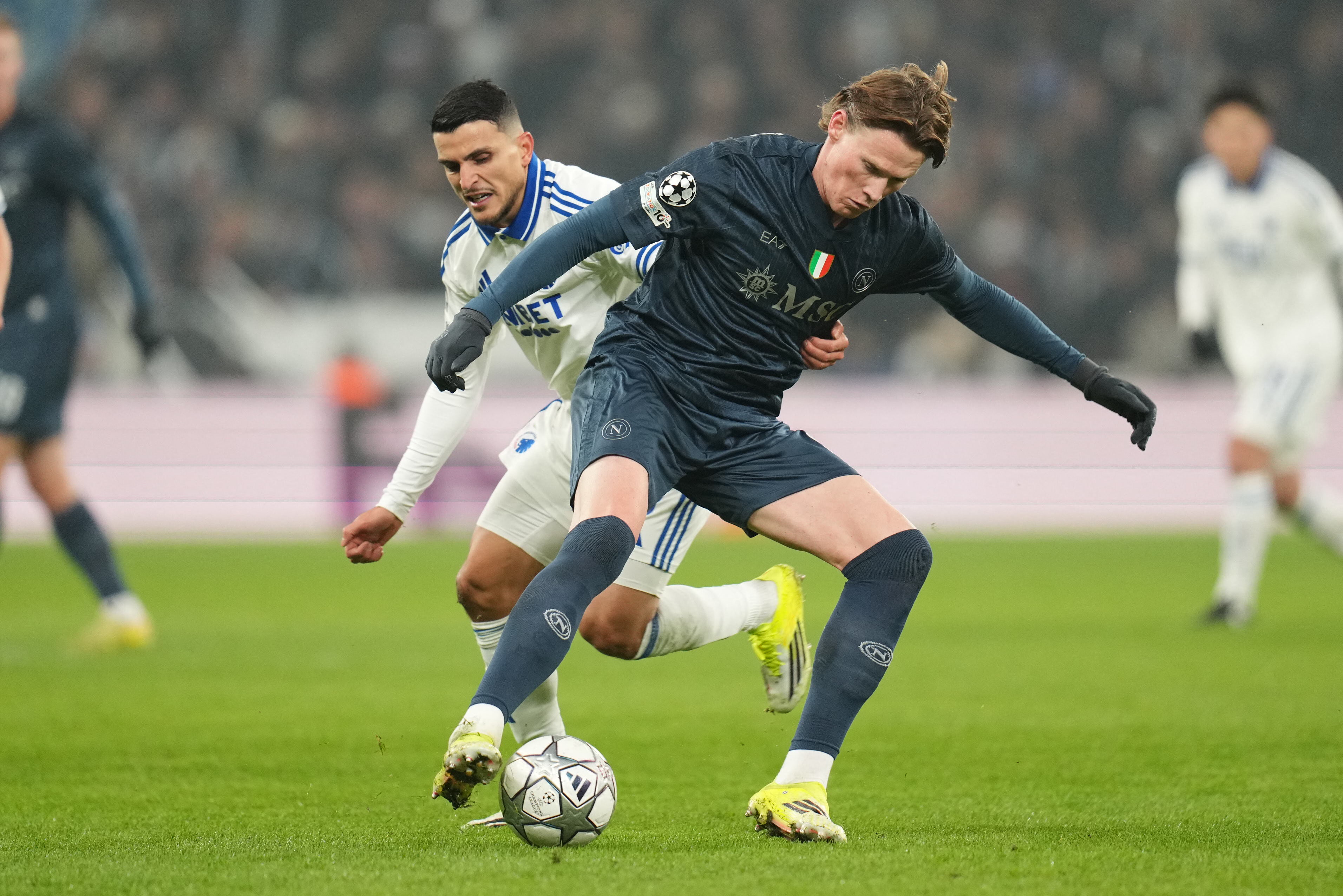 FC Copenhagen's Norwegian forward #10 Mohamed Elyounoussi (L) and Napoli's Scottish midfielder #08 Scott McTominay vie for the ball during the UEFA Champions League, league Phase - day 7 football match between FC Copenhaben and SSC Napoli in Copenhagen, Denmark, on January 20, 2026. (Photo by Liselotte Sabroe / Ritzau Scanpix / AFP) / Denmark OUT