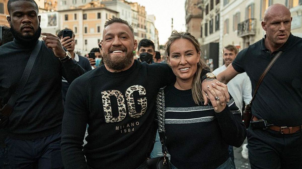 Conor McGregor walks around Rome while his bodyguards hold his glass and record videos