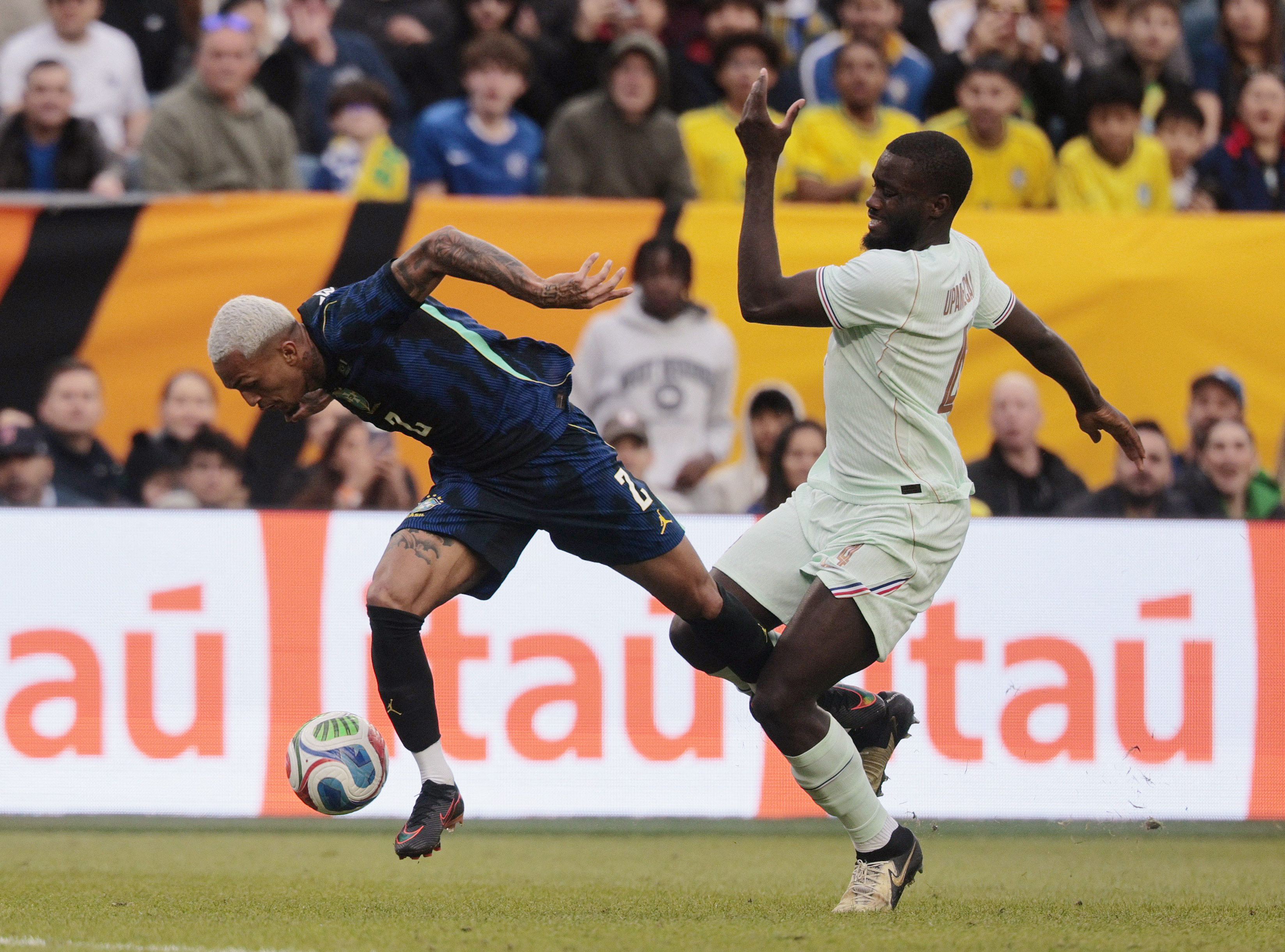 Soccer Football - International Friendly - Brazil v France - Boston Stadium, Foxborough, Massachusetts, U.S. - March 26, 2026 Brazil's Wesley Franca in action with France's Dayot Upamecano REUTERS/Brian Snyder